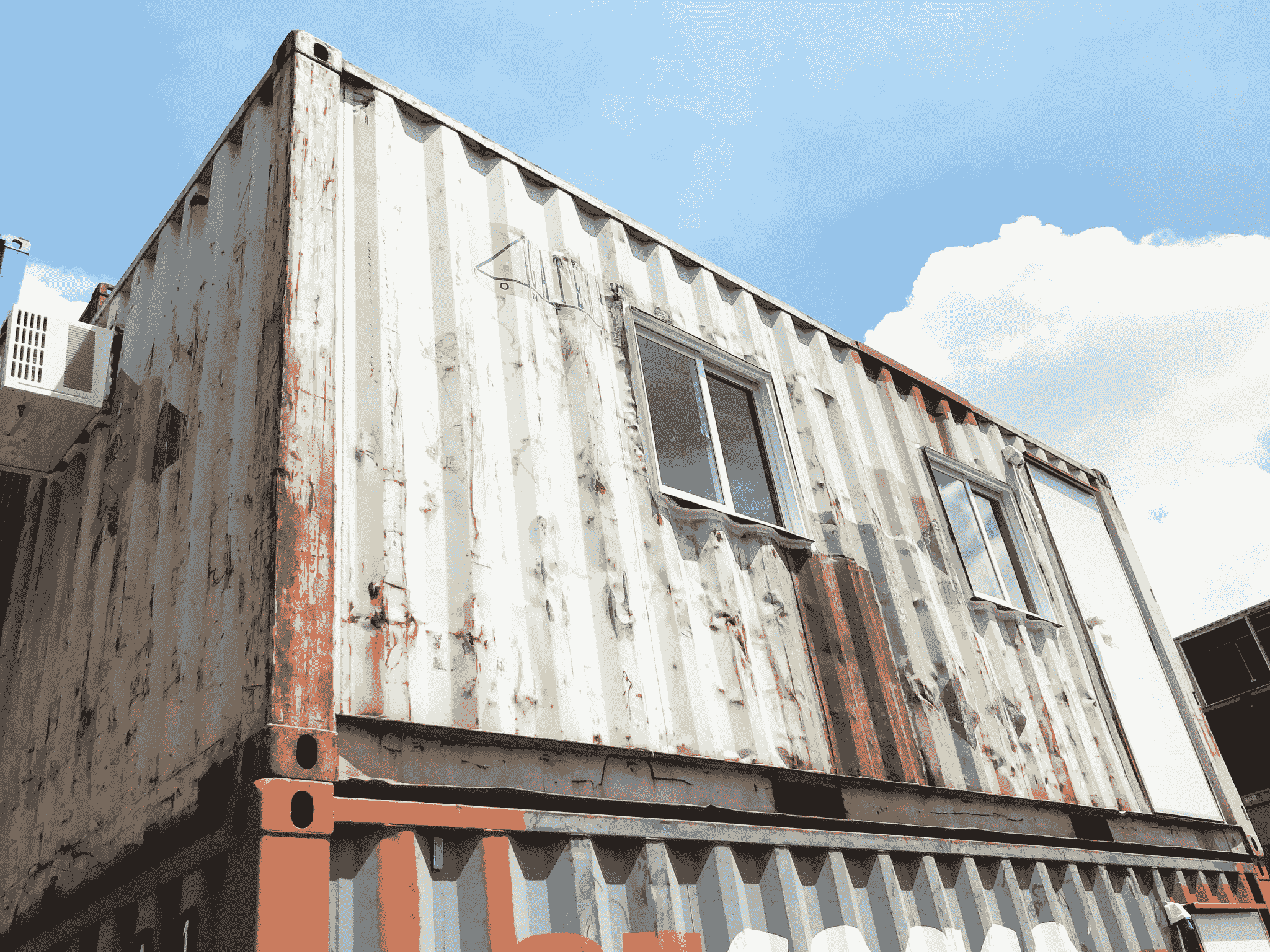 Weather-resistant portable house container with durable construction materials