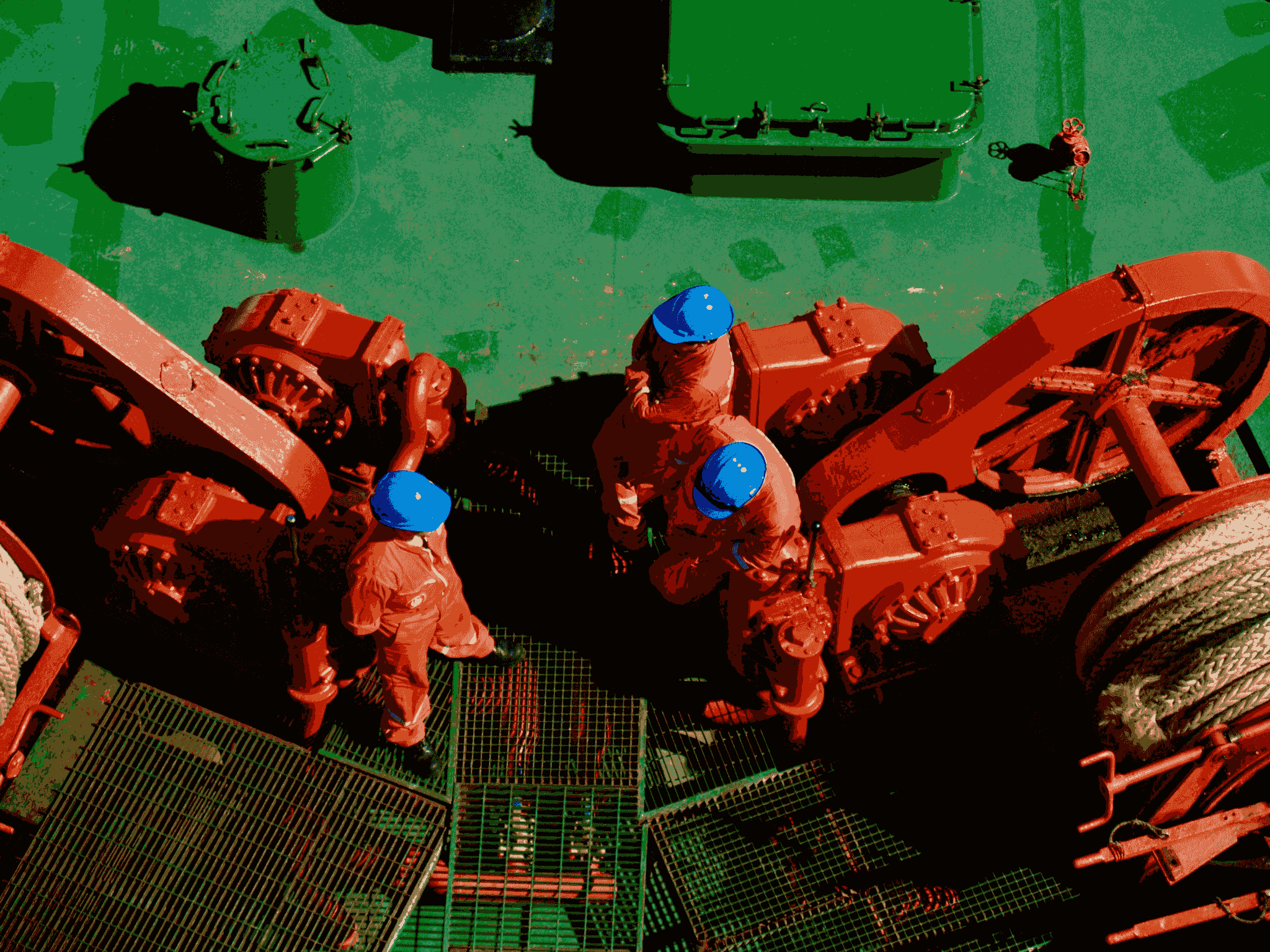Oil rig housing featuring crew quarters with bunk beds and personal storage.