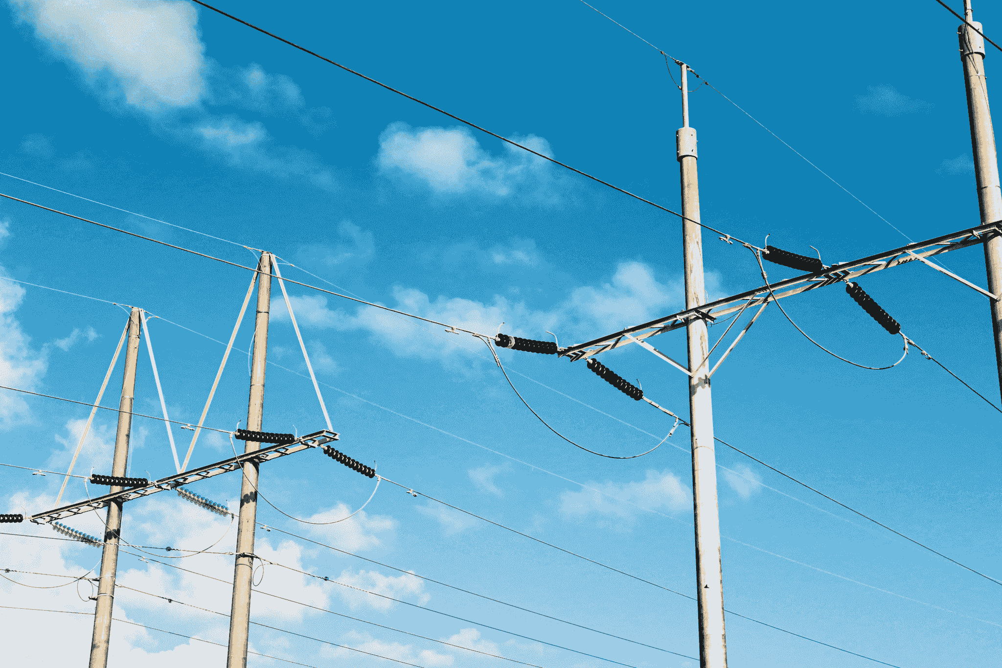 Different types of overhead transmission lines showcasing their structures.