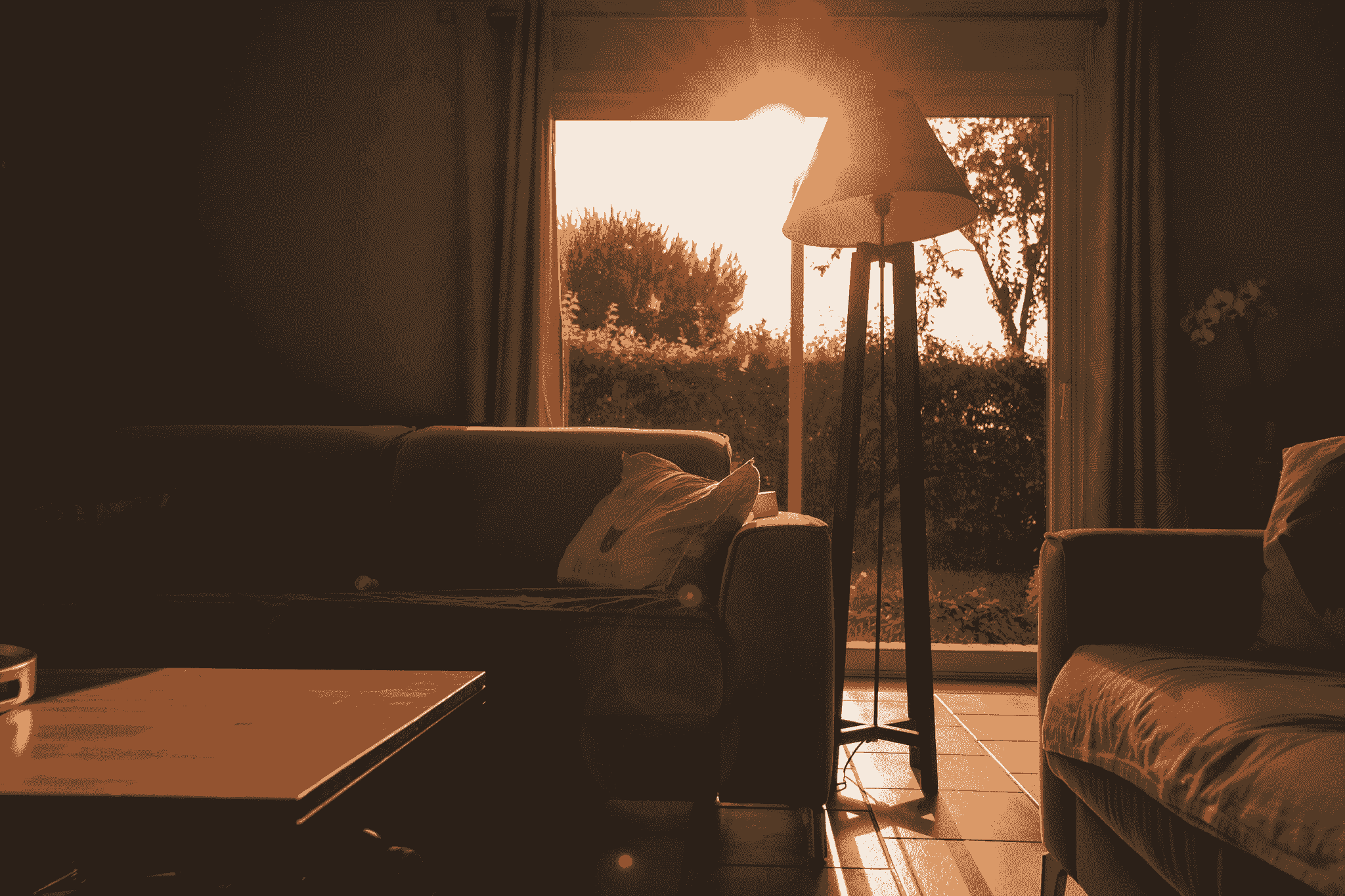 Automated blinds and shades and smart lighting systems integrated into prefab house's sun room