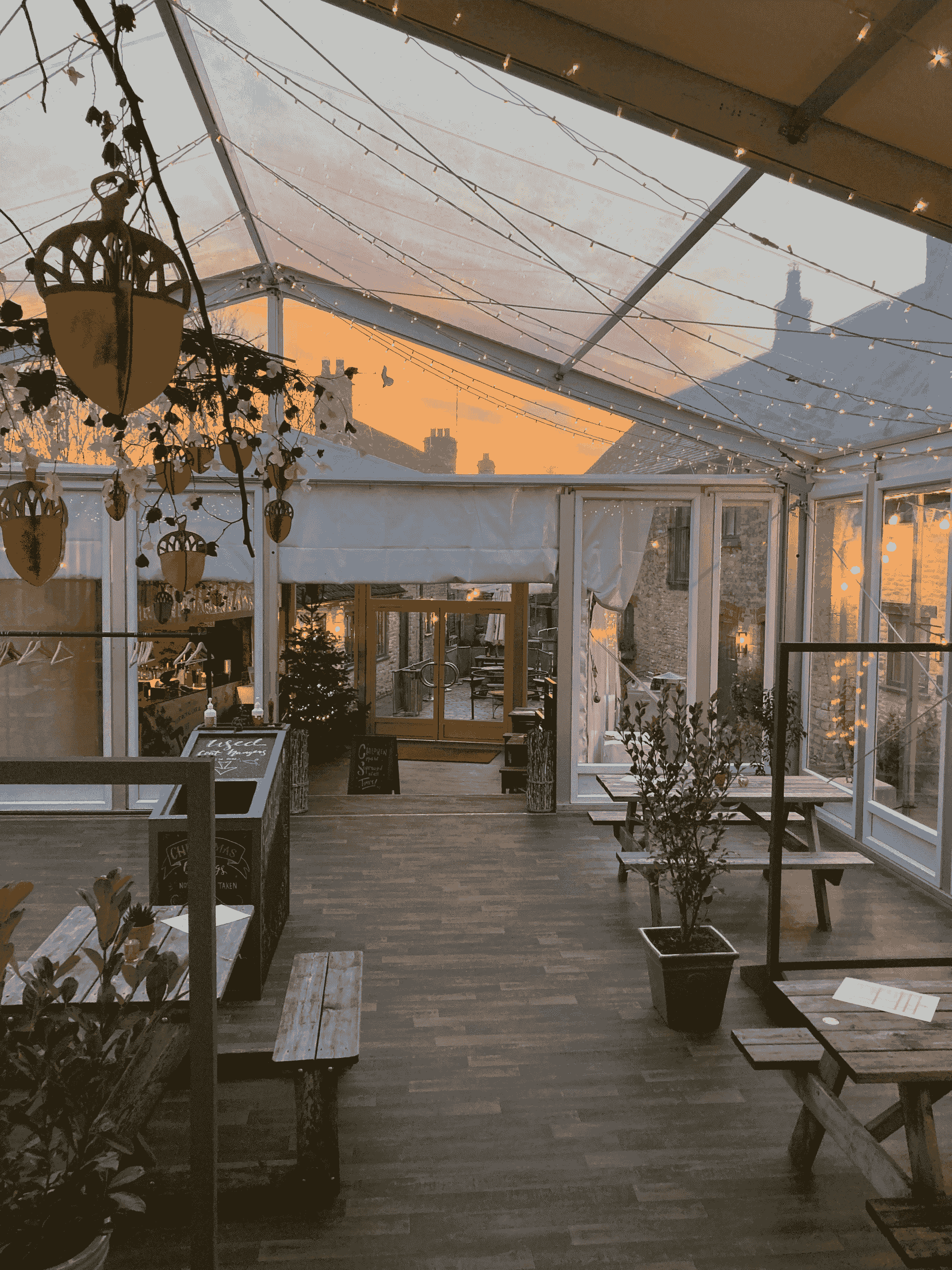 Stunning small container coffee shop design featuring outdoor patio space.