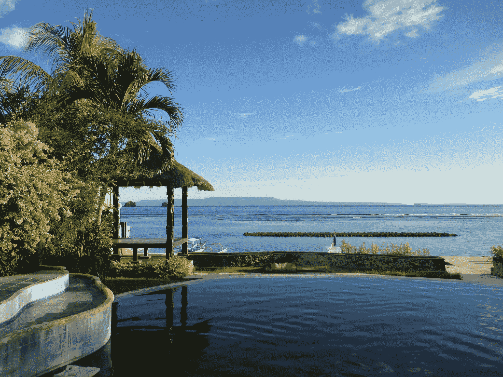 Luxury travel beachfront villa with private infinity pool