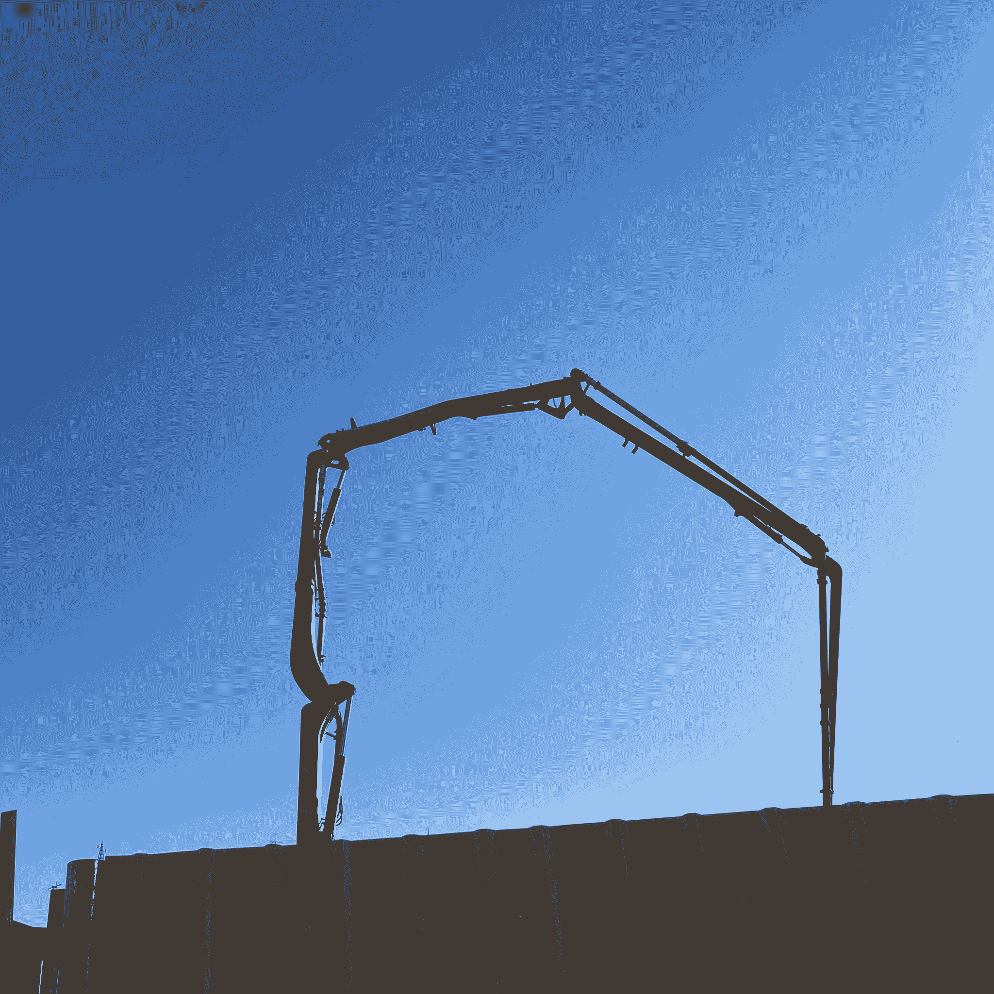 Construction container being lifted by crane at a busy construction site