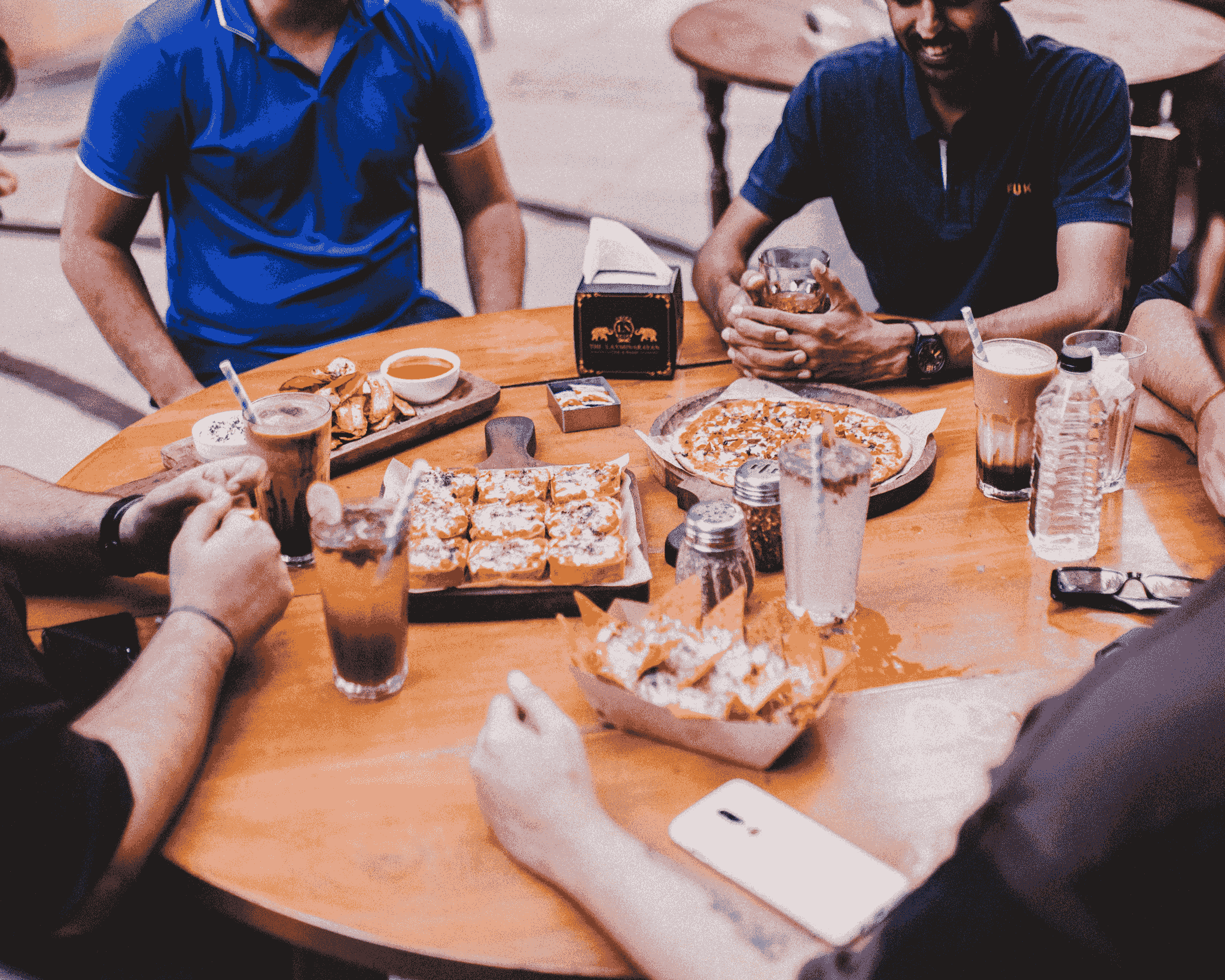 Diverse group enjoying food at a vibrant pop-up restaurant