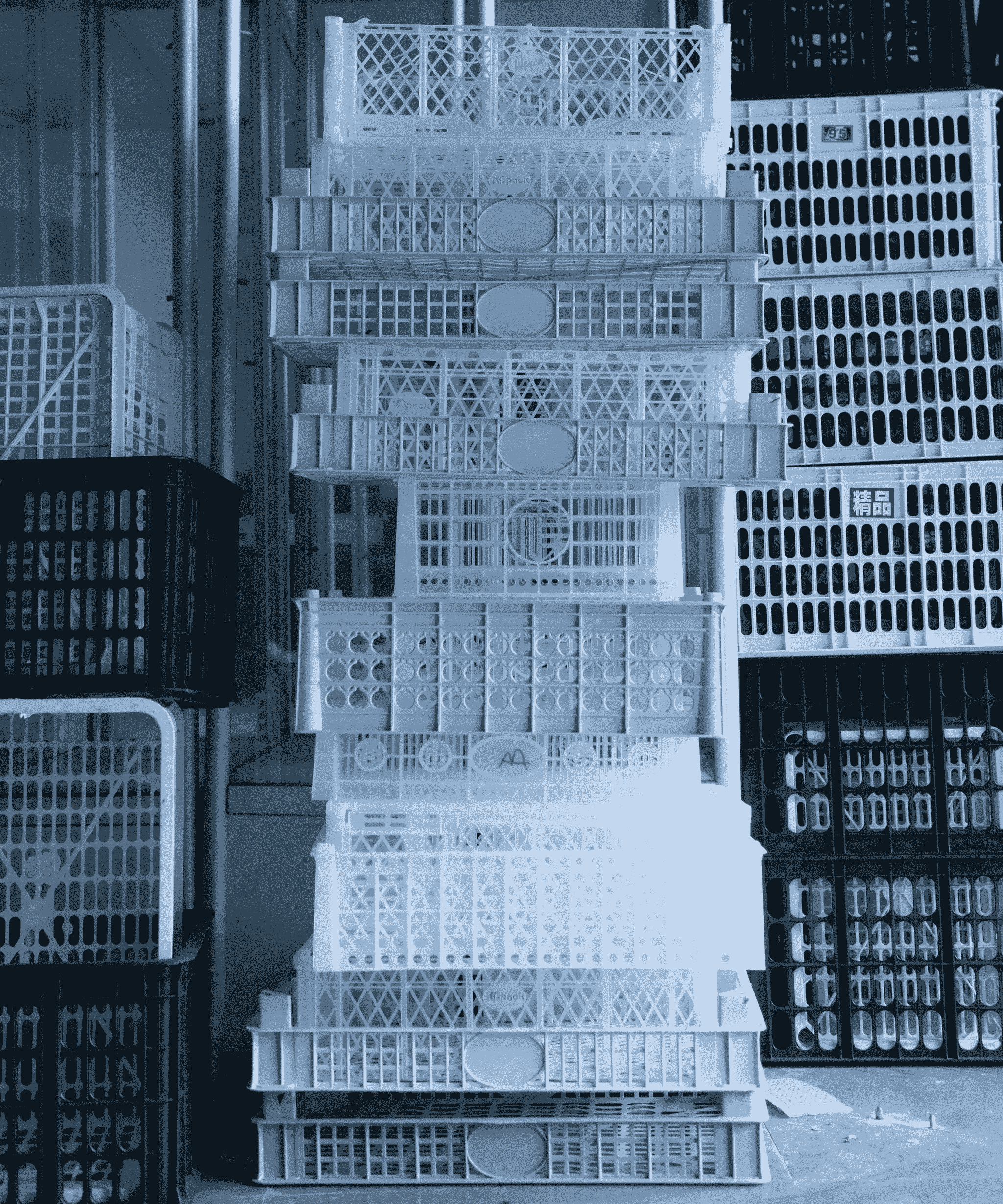 Neatly stacked foldable containers in warehouse setting