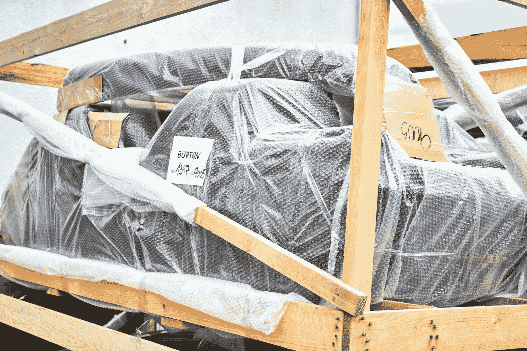 Durable foldable container being loaded onto truck for transportation