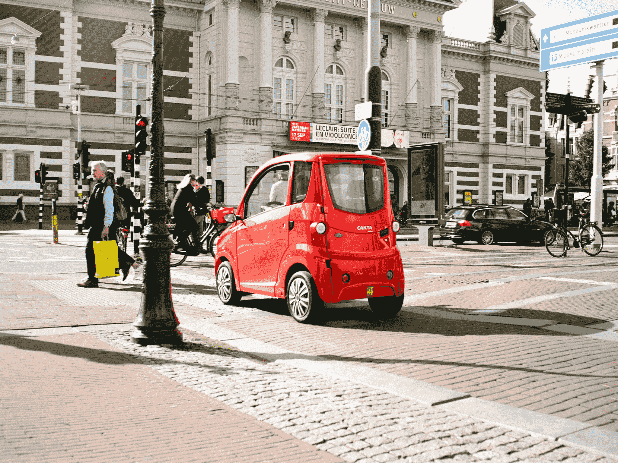 Eco-friendly electric vehicle made in China driving through cityscape