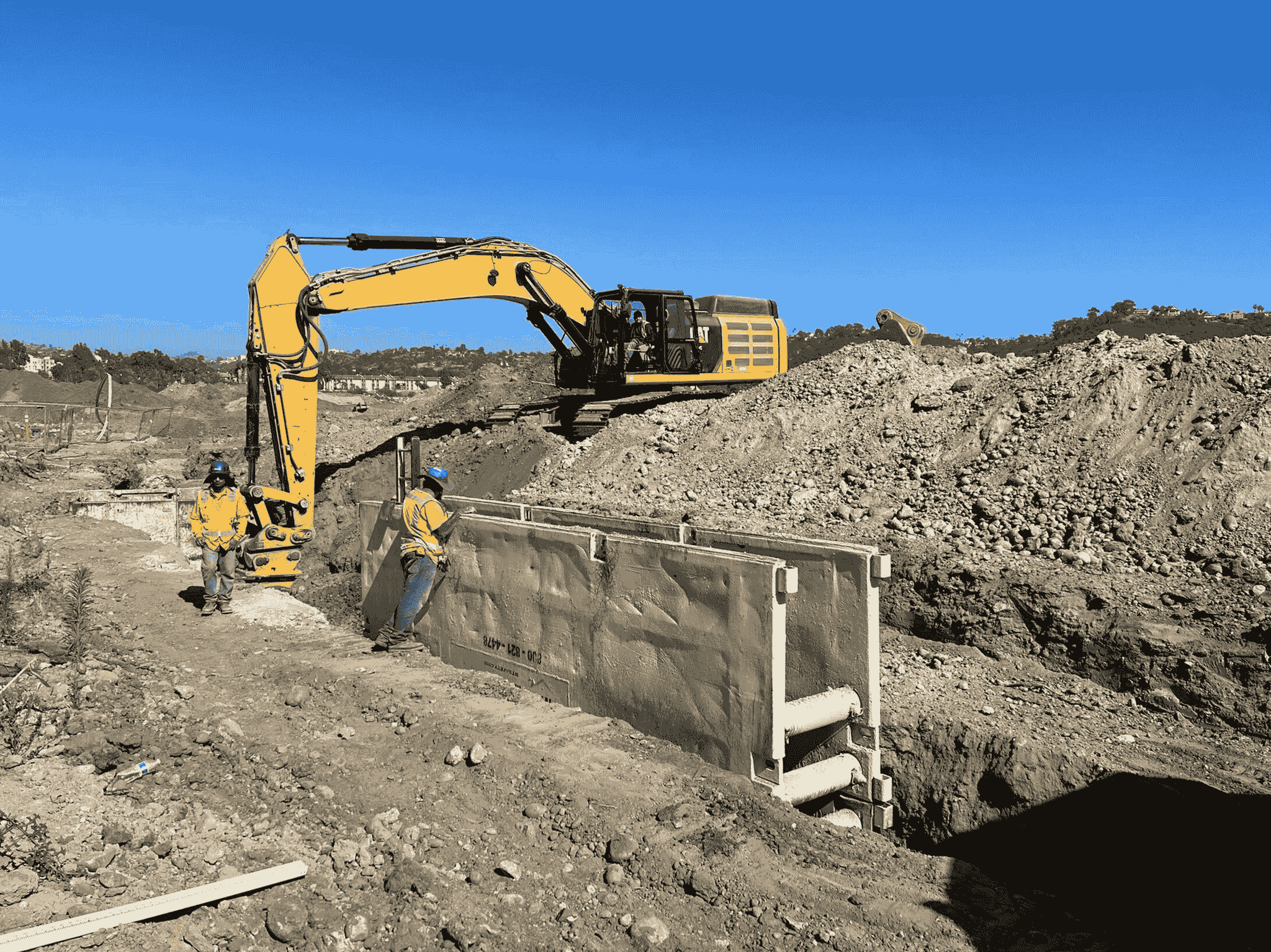 heavy equipment inspections conducted by professionals at a construction site.
