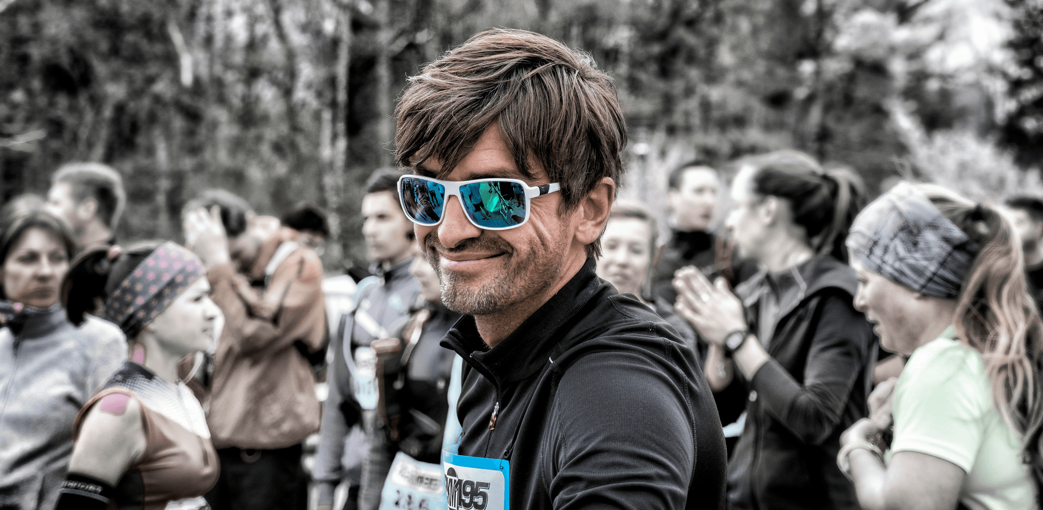 man wearing running glasses while jogging outdoors