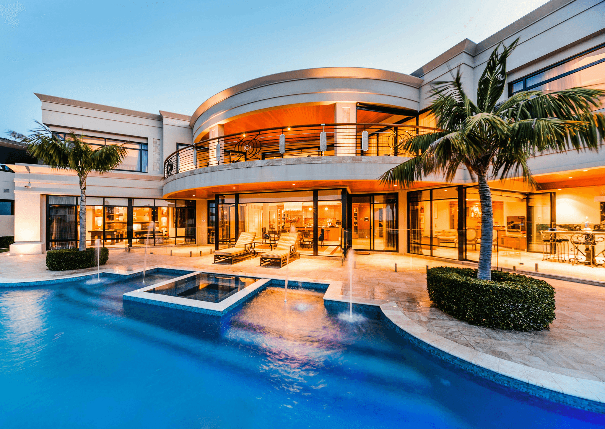This image shows a large villa luxury mansion with exquisite pool and pool deck.
