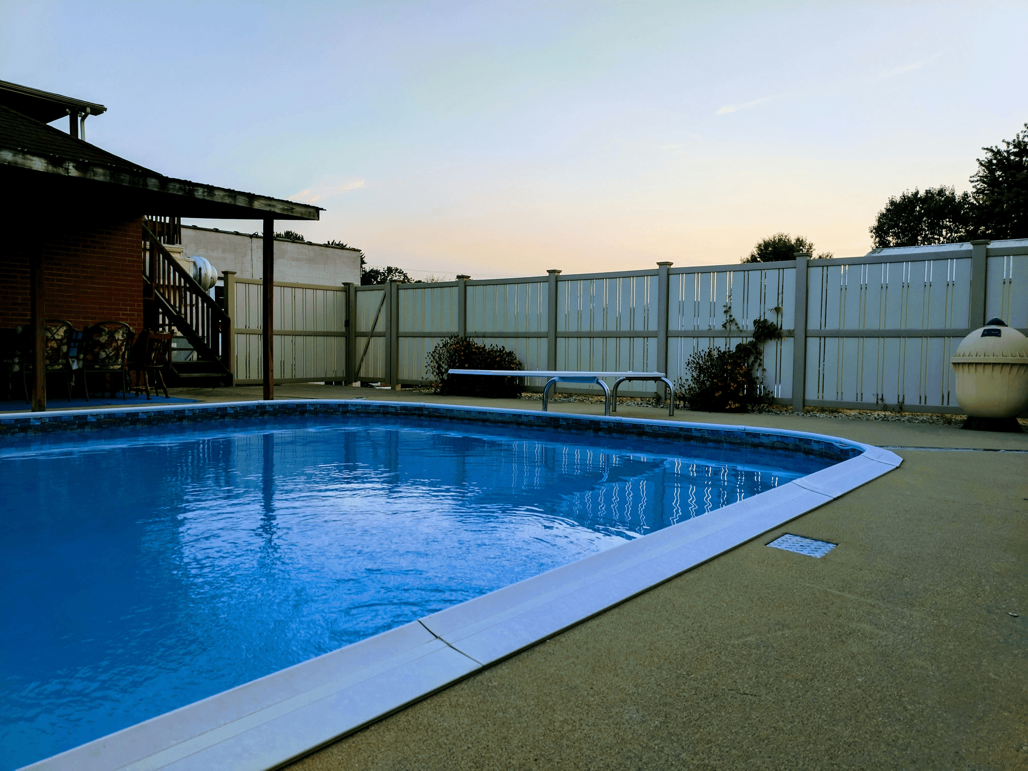 Stylish timber pool fencing enhancing safety around swimming area.