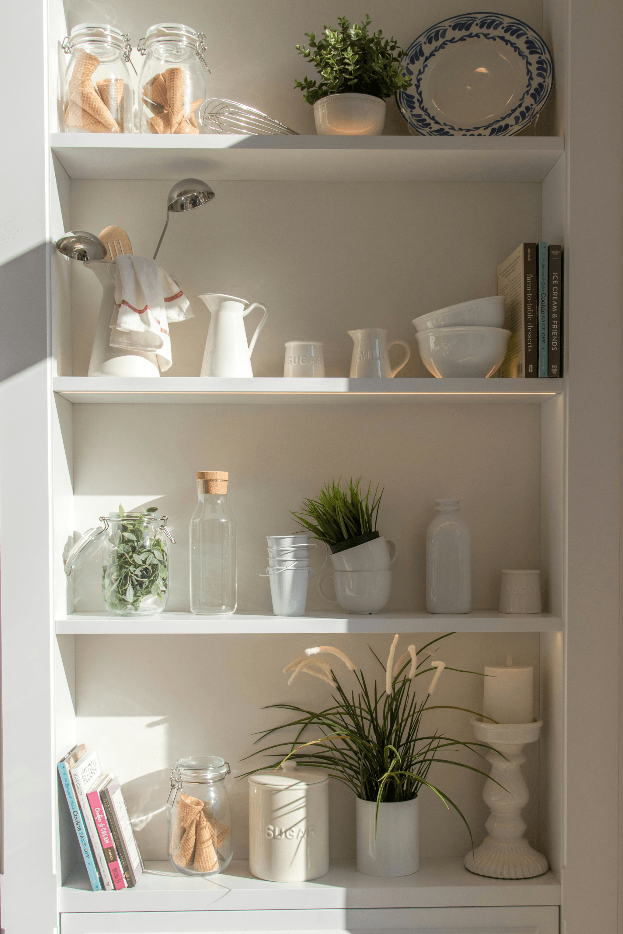 Efficiently organized customized shelving in upper corner kitchen cabinet