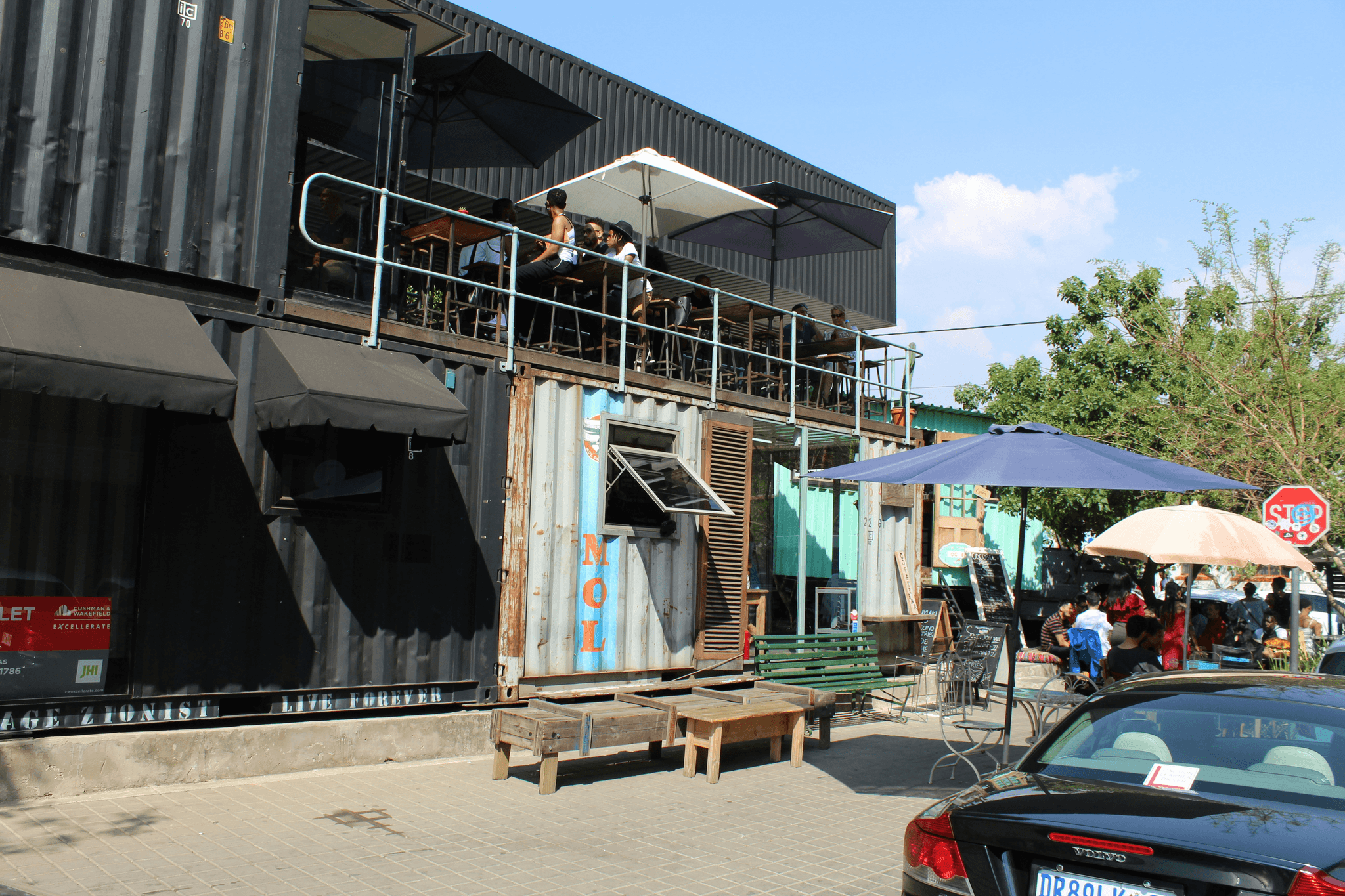 Container Coffee Shop Exterior with Vibrant Signage