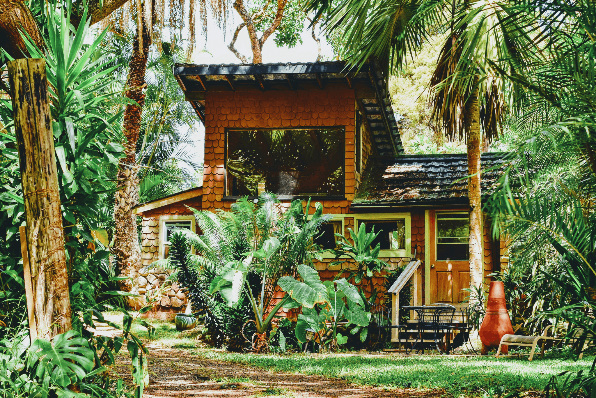 Beautiful view of an apple cabin tiny house surrounded by nature.