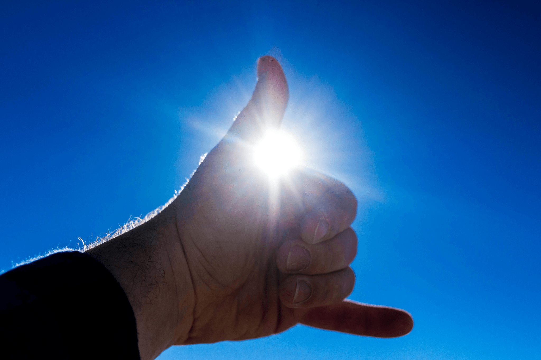 Illustration showing sun shining on person's skin with Vitamin D