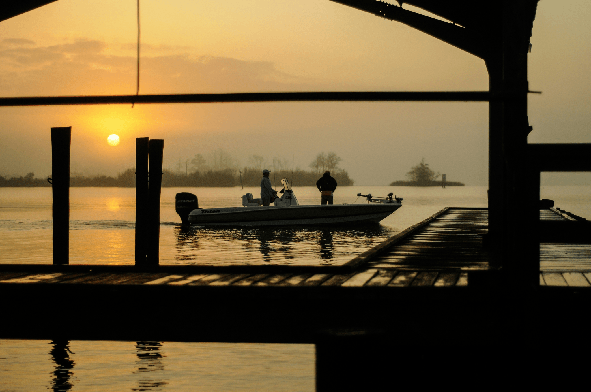 fiberglass pontoon enjoying serene sunset on lake