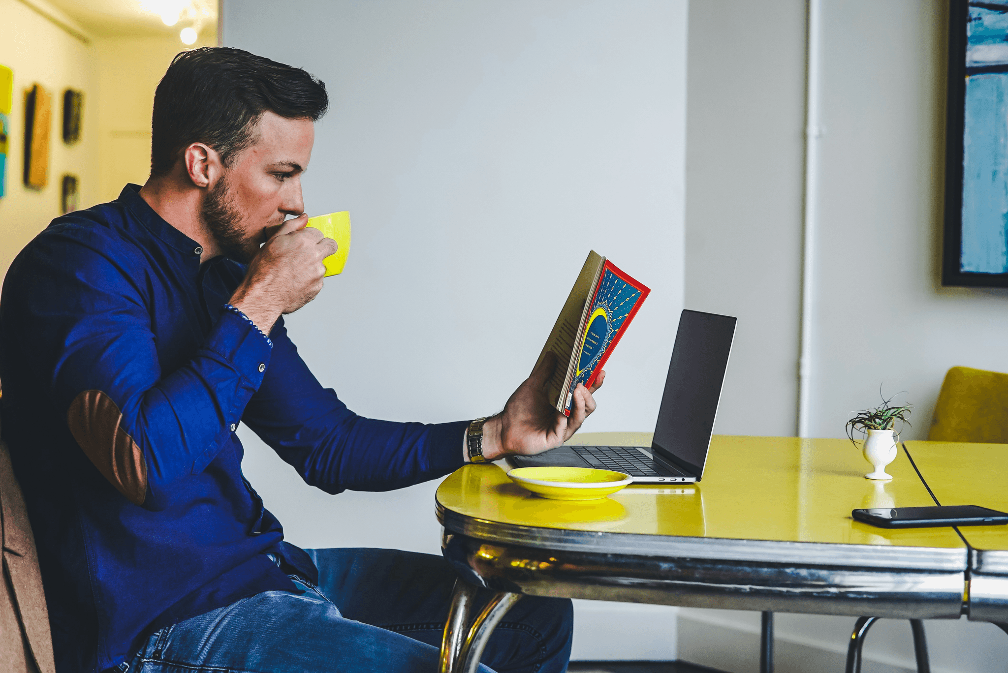 A person working at a portable office setup in a coffee shop