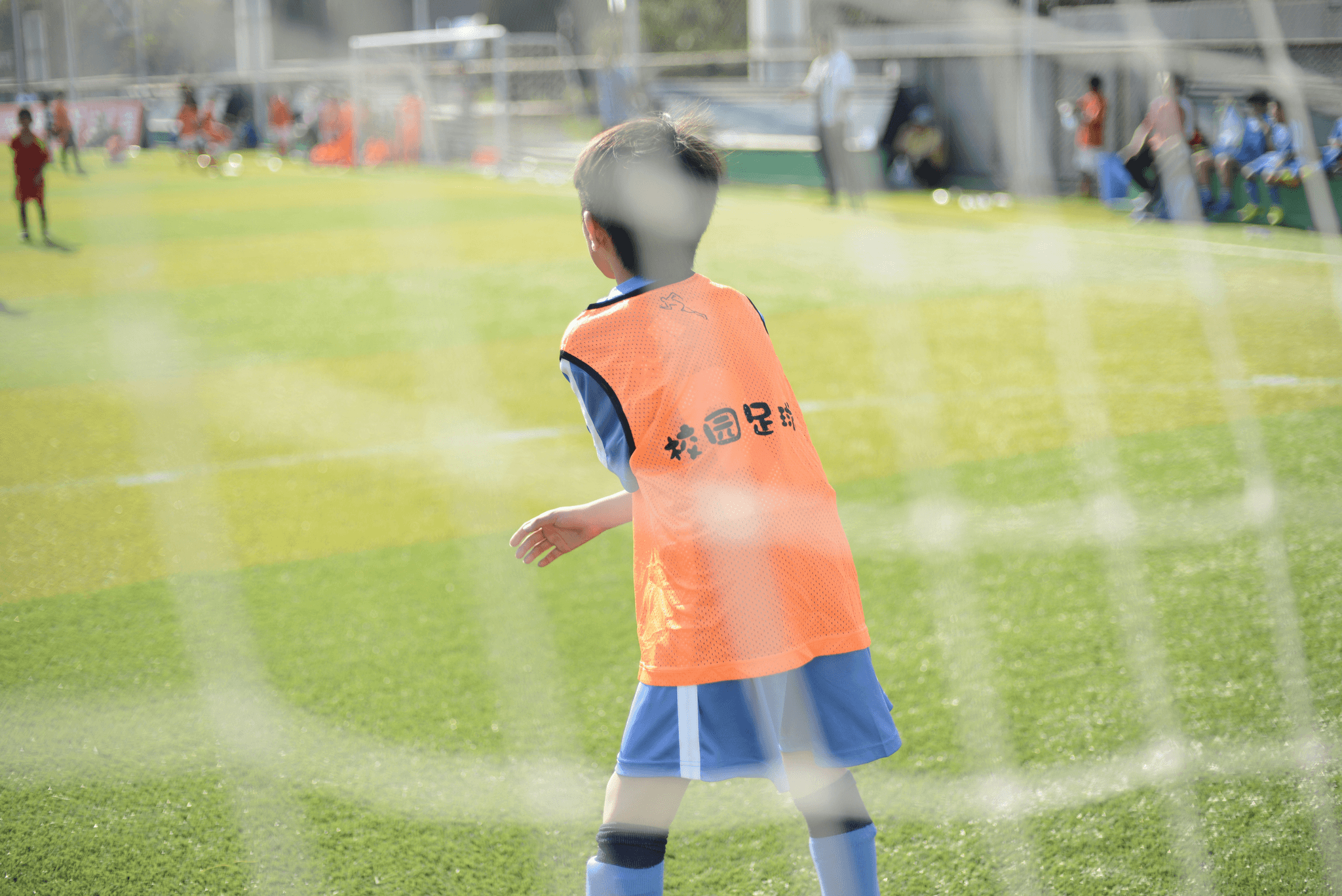 Kids sports glasses worn by young athlete during soccer game