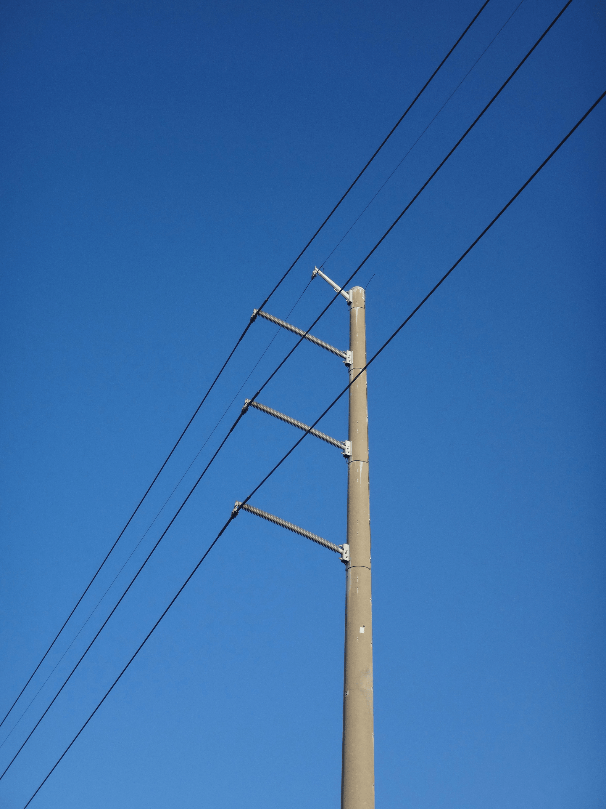 top tie enhancing stability in electrical transmission