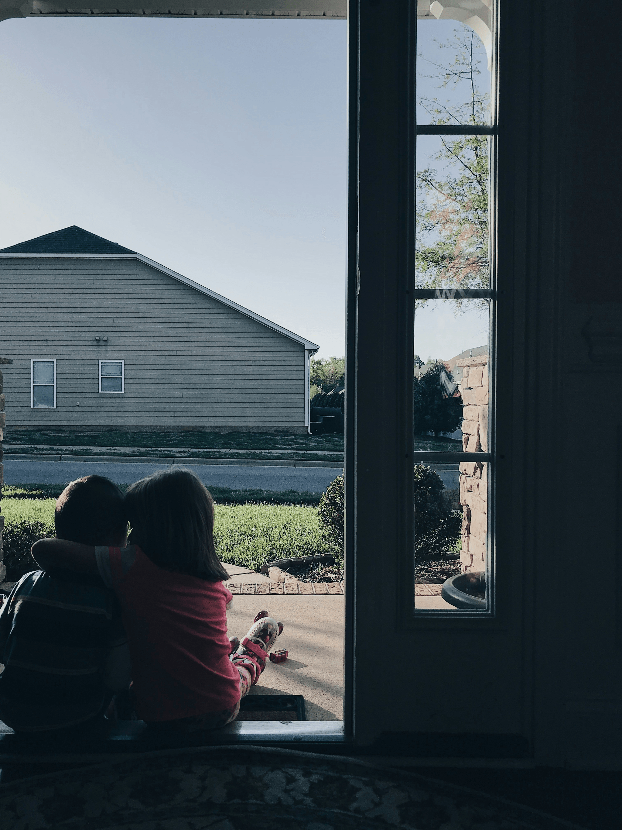 Community vibe around a two story home encouraging interactions.