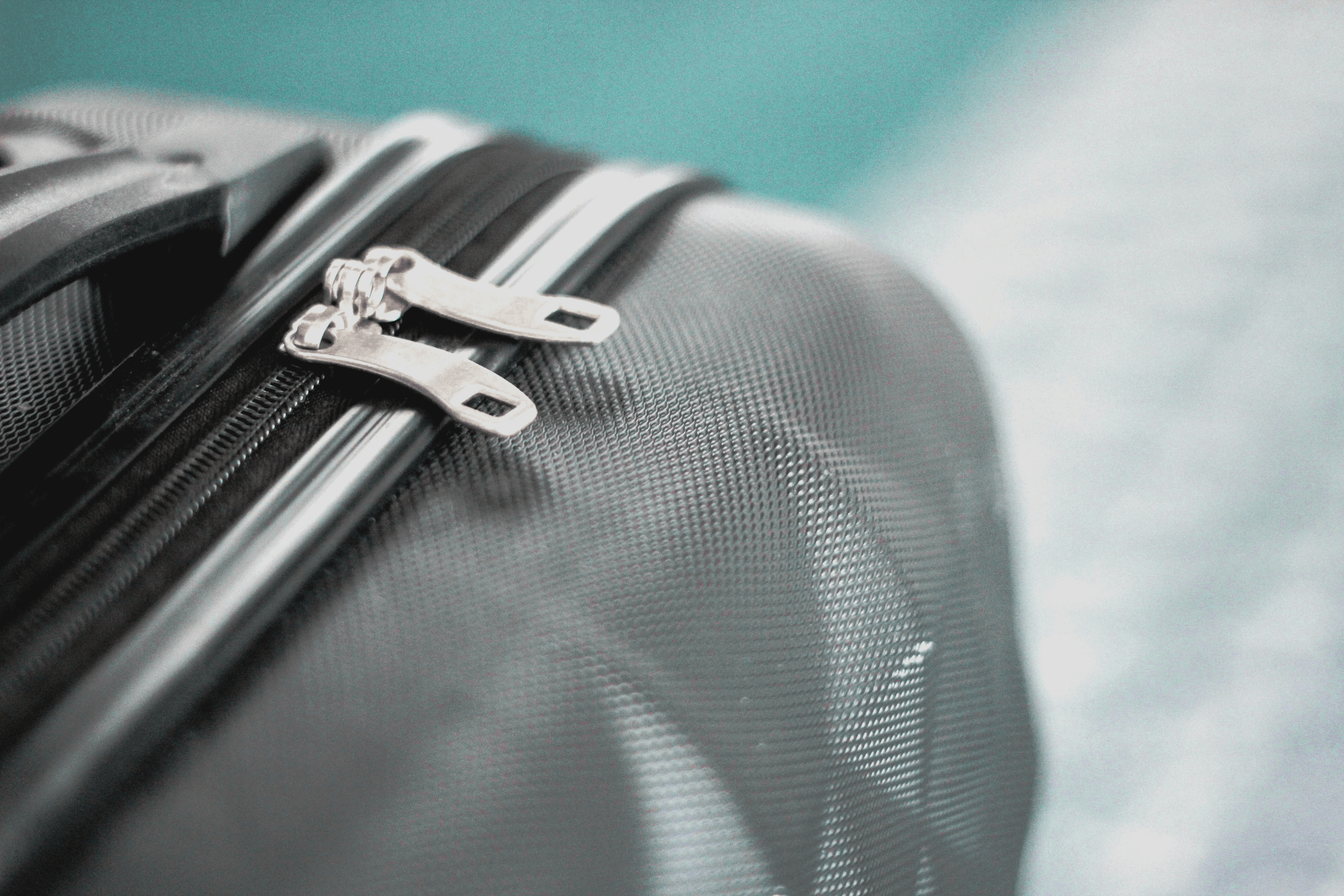 Luggage Inspection focusing on wheeled upright luggage zipper quality