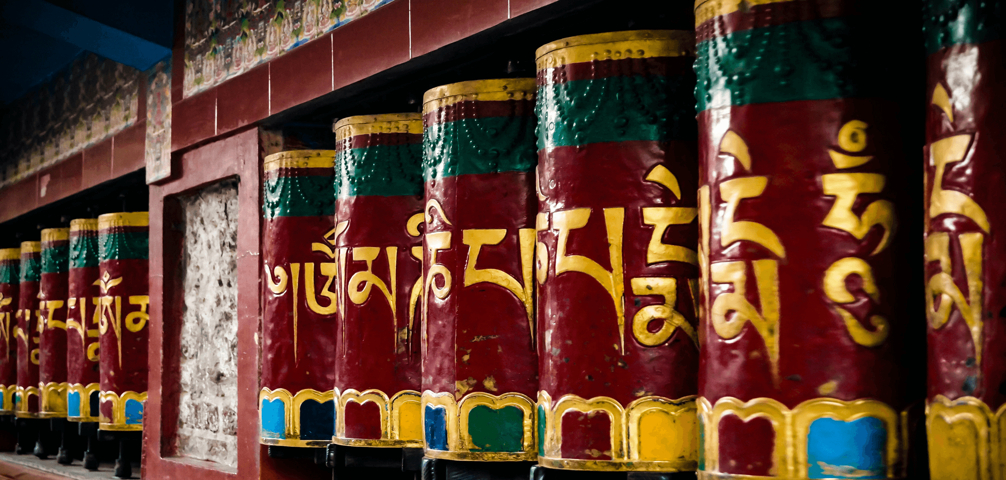 Prayer wheels and Jokhang Temple in Lhasa, Tibet.