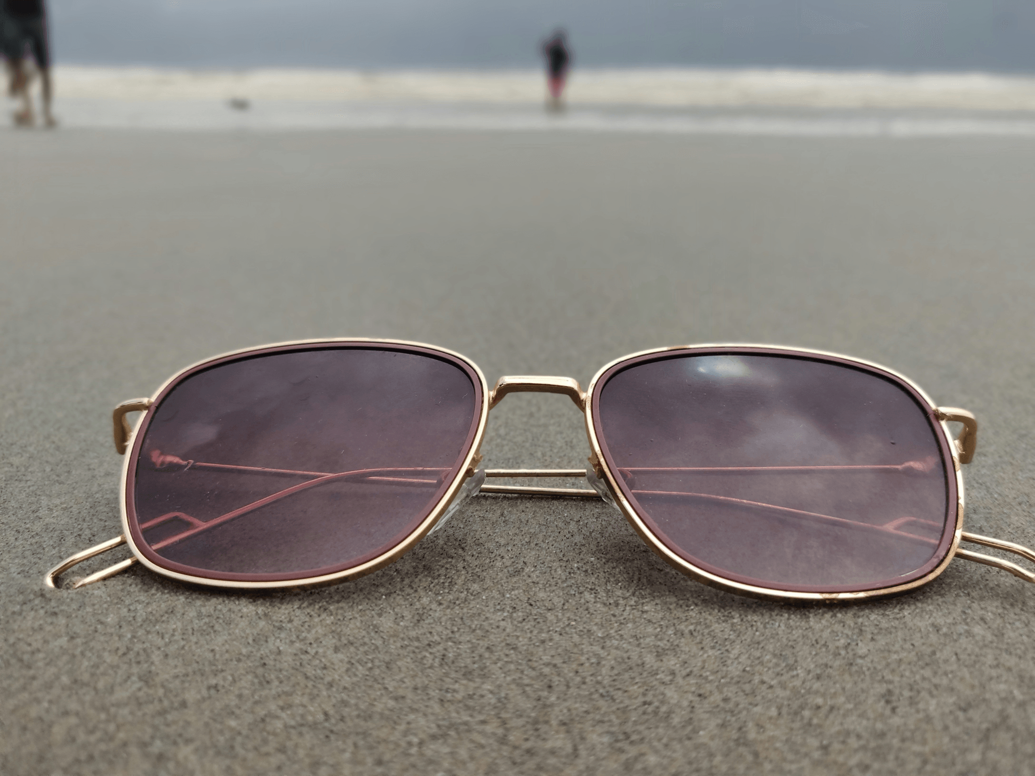 Custom pink eyewear showcasing stylish design with polarized lenses.