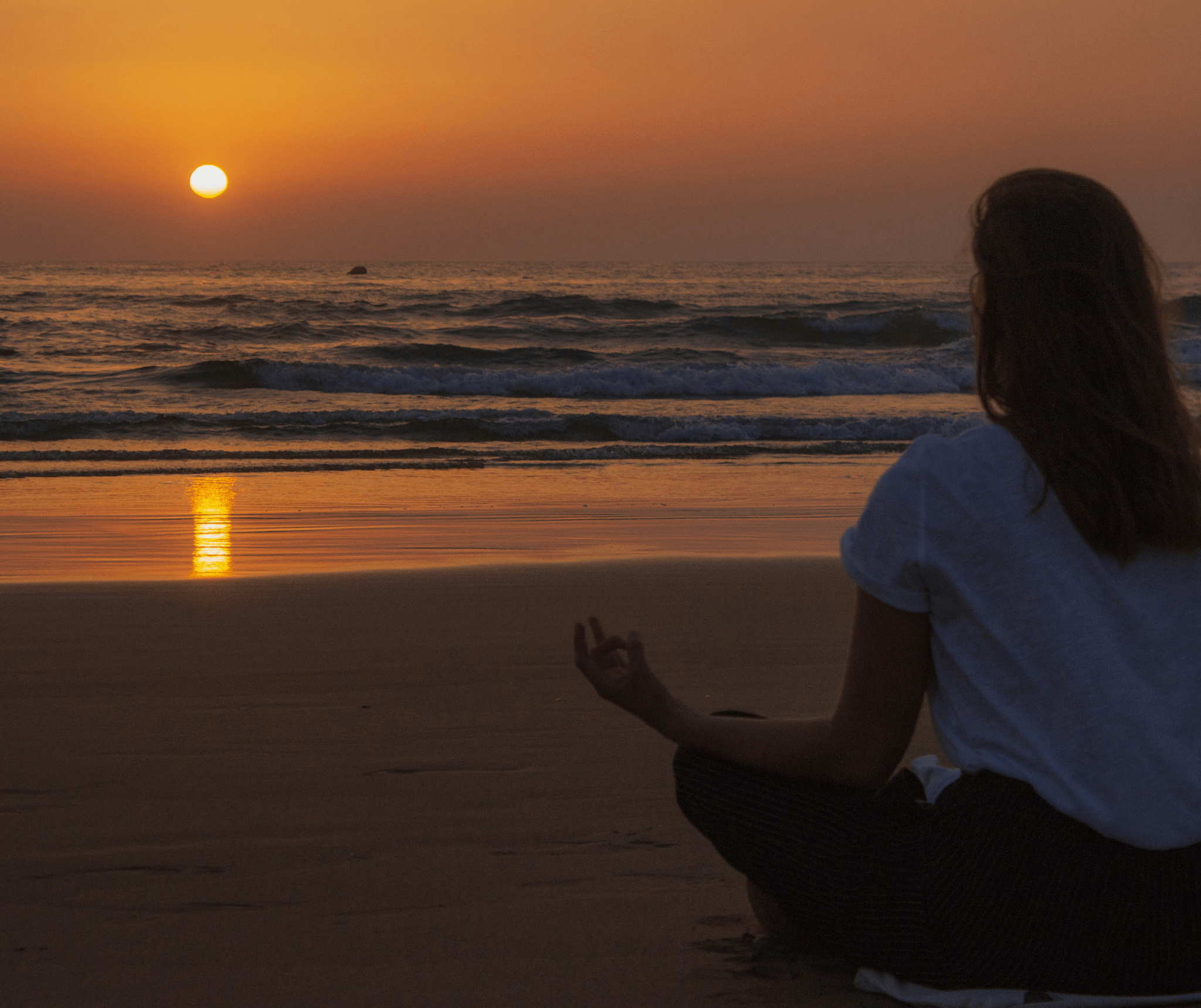 Experience peaceful yoga sessions on resort's beach during sunset