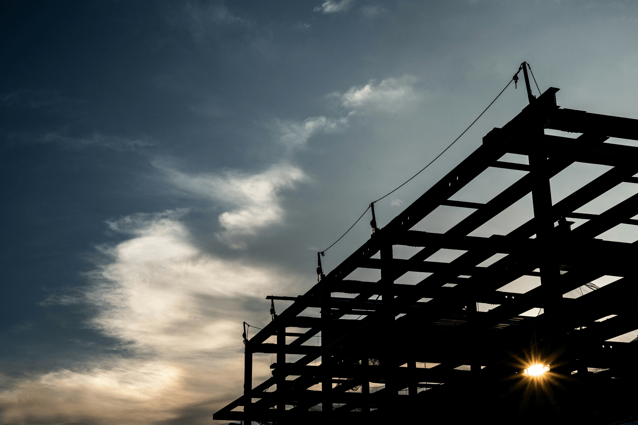 workers using framing machine for light gauge steel framing