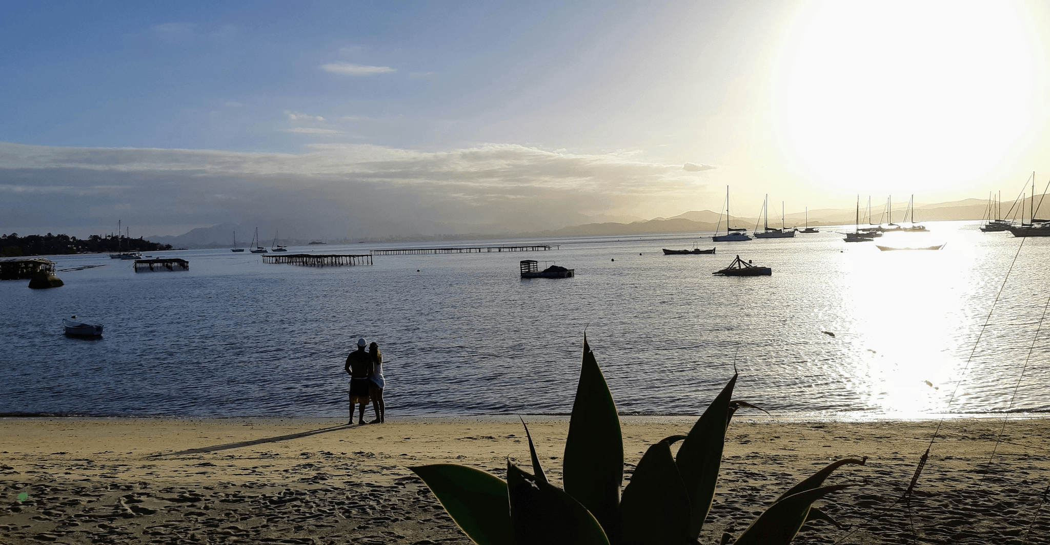 catamaran offshore boats exploring beautiful islands at sunset