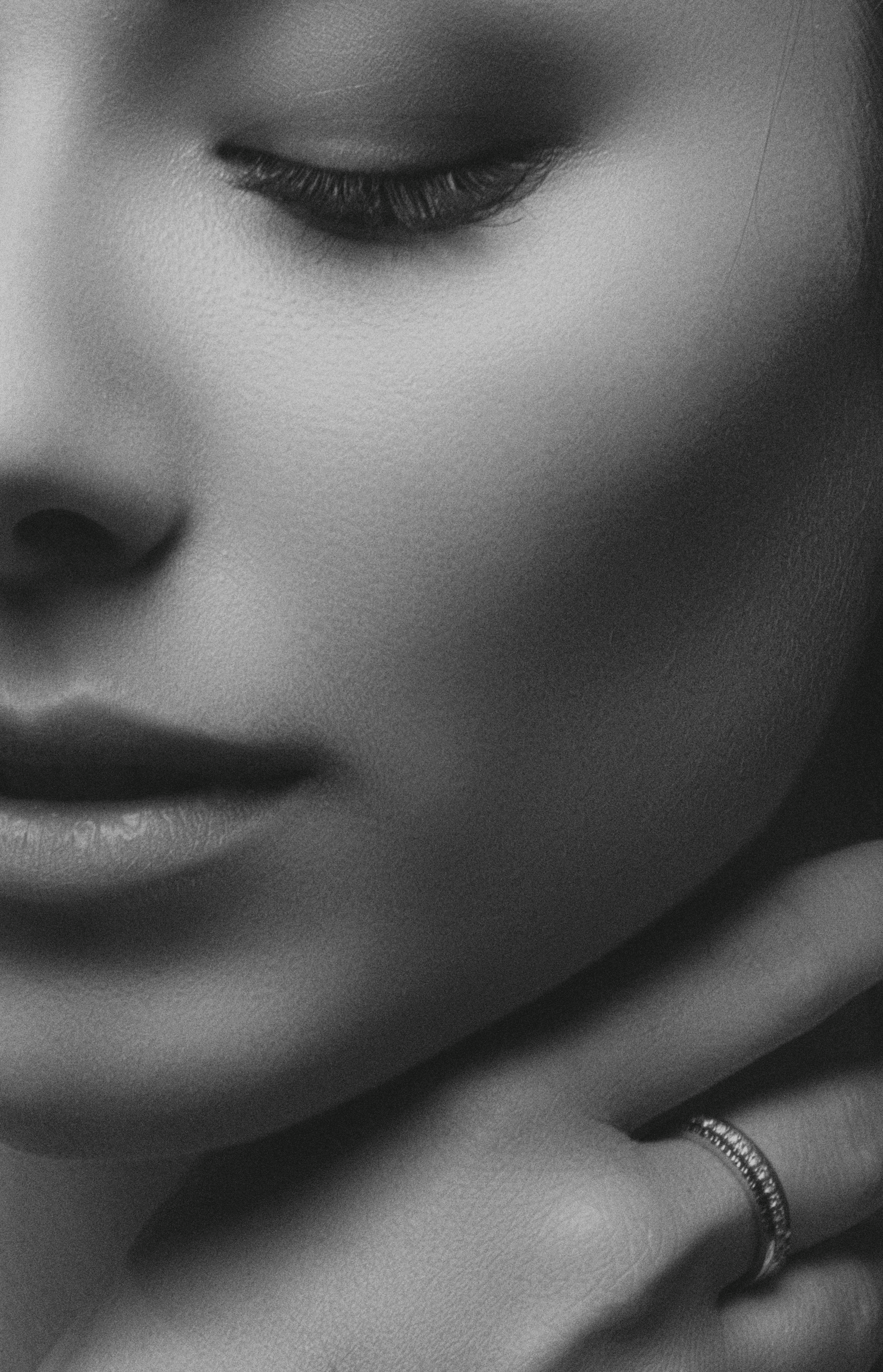 Soft, black and white artistic close-up of a woman's face representing elegant, science-backed wellness stacks by Lady Reset