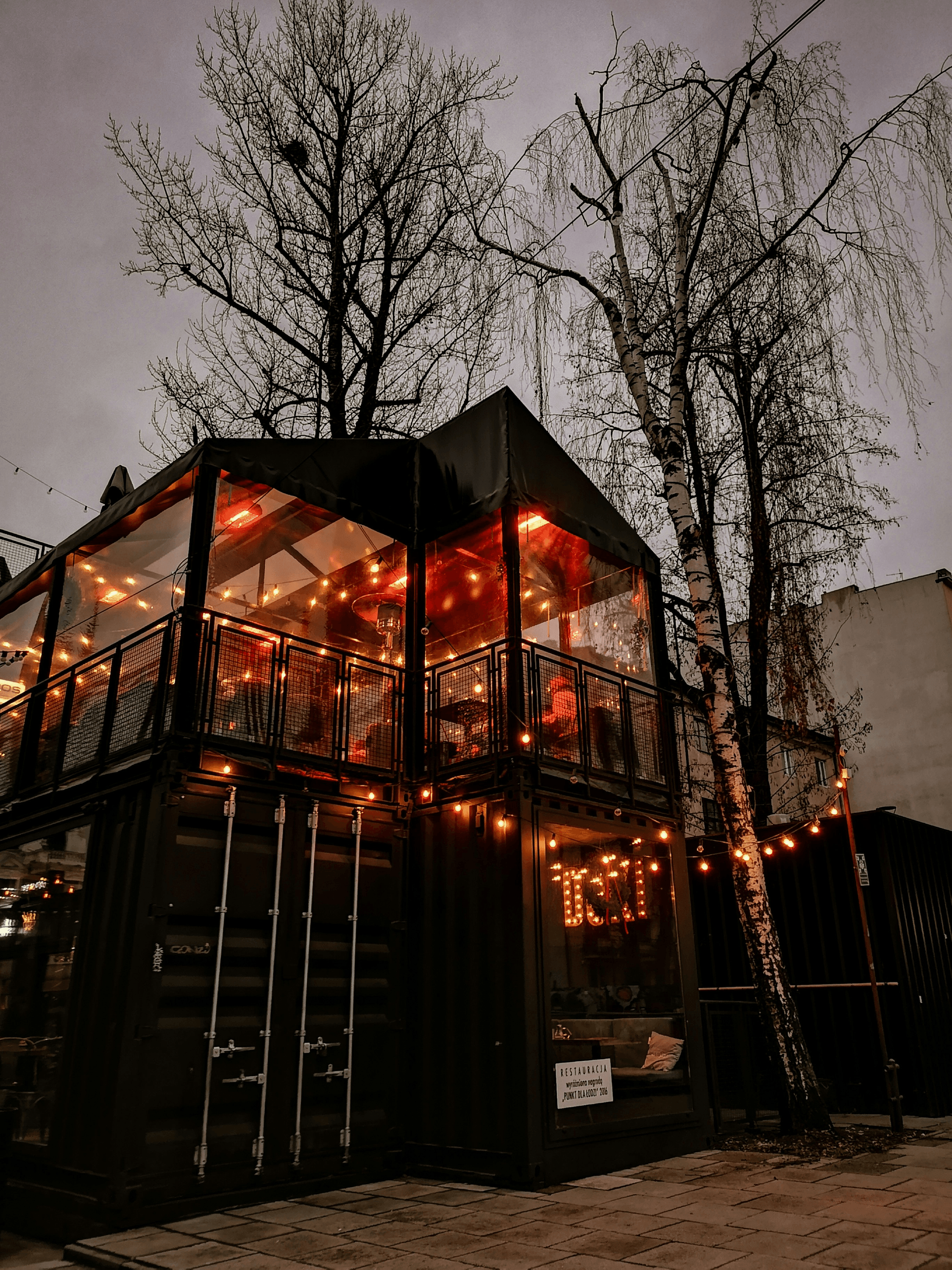 Holiday container arrangement adding festive charm