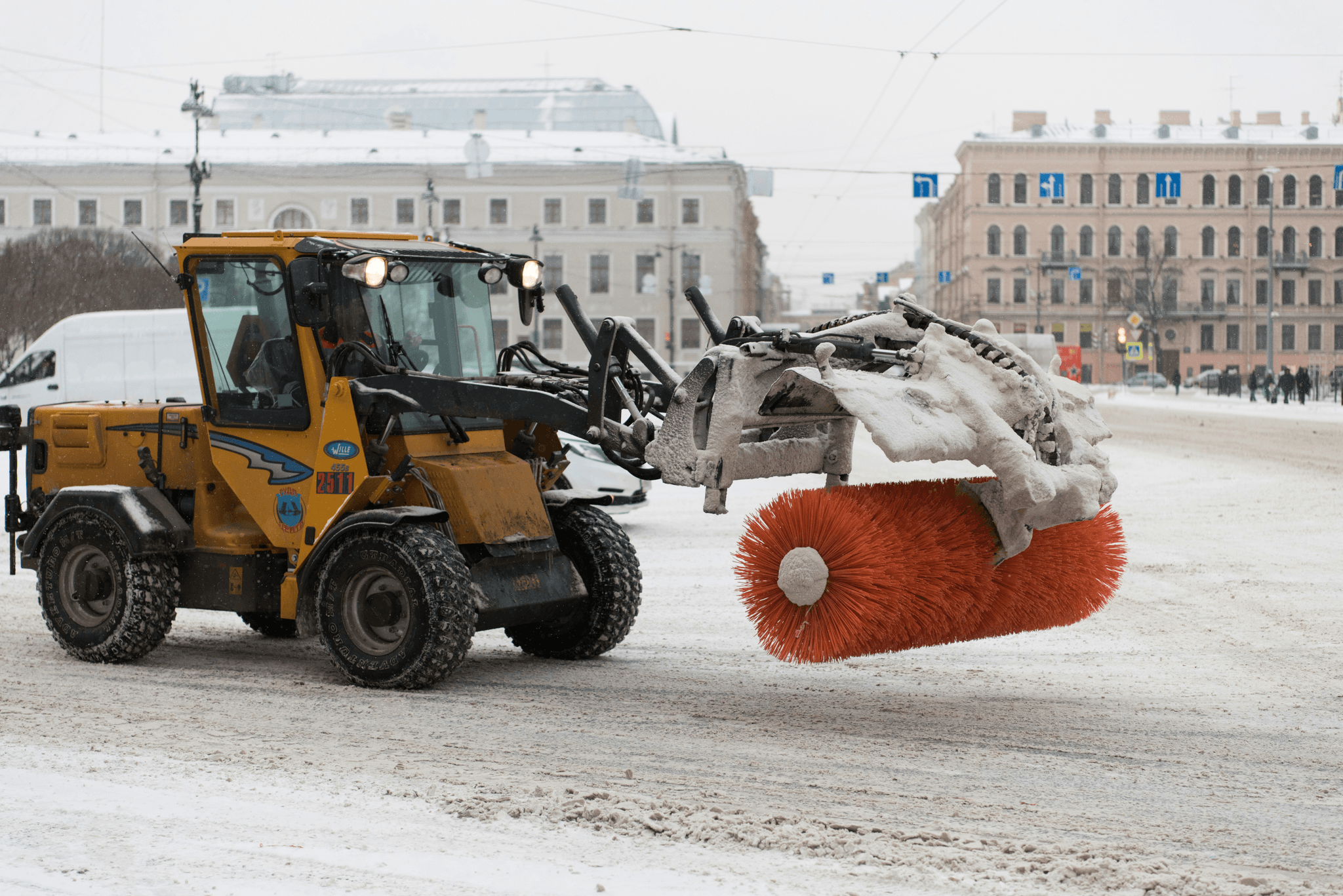 Powerful truck snow blower clearing streets from heavy snowfall.