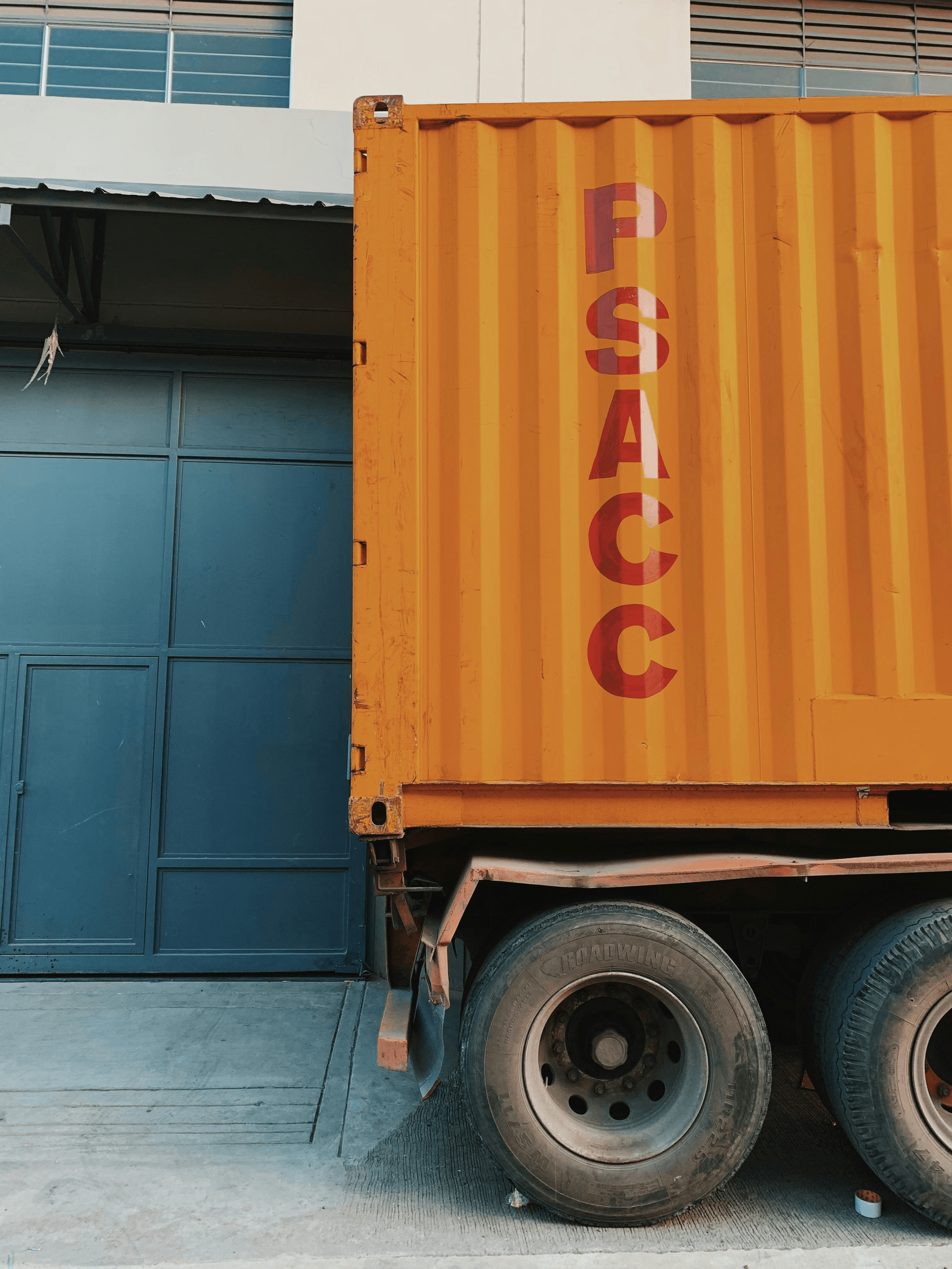 Flat Pack Shipping Container being loaded onto a truck
