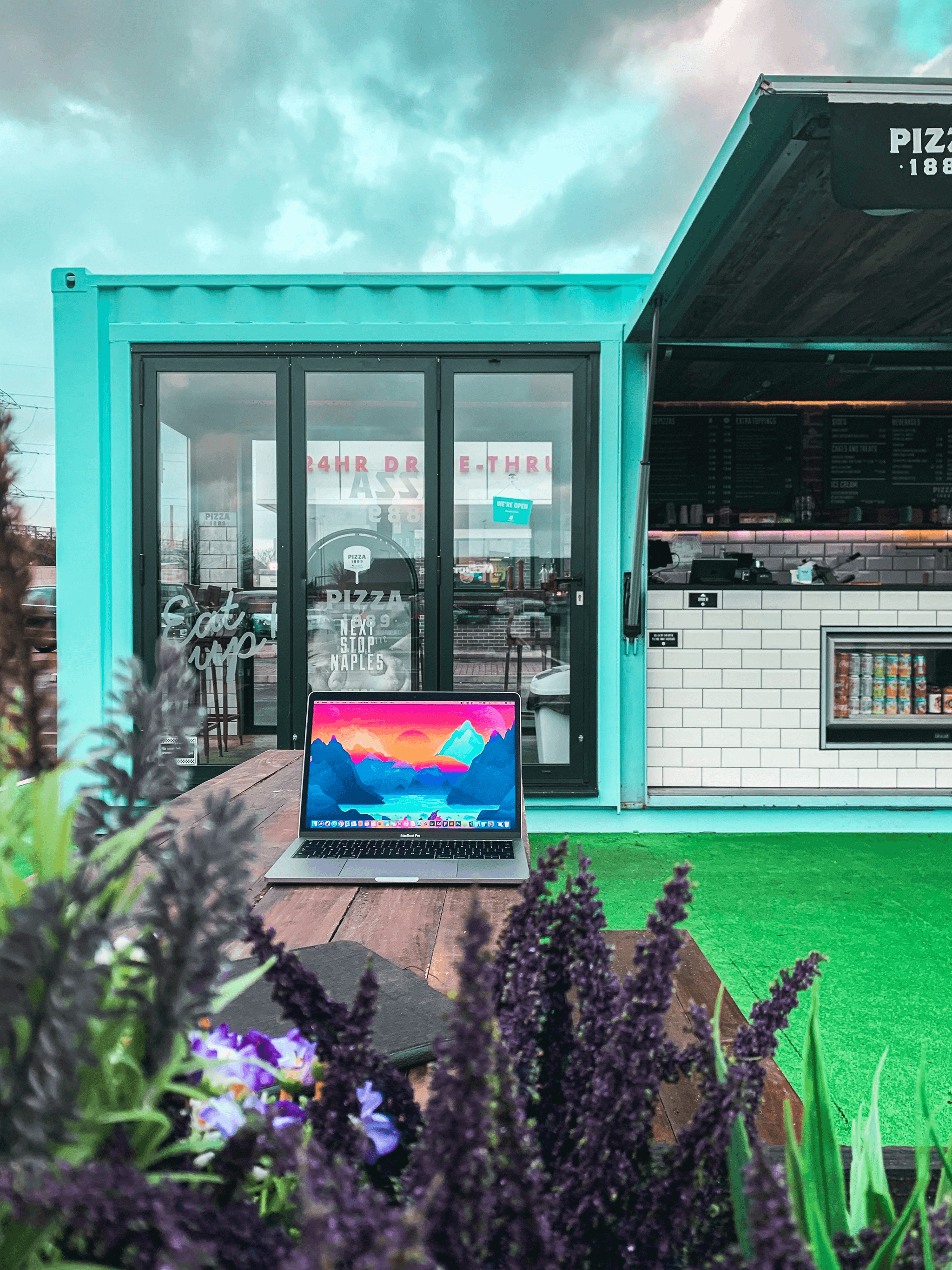 Beautiful sustainable landscaping around storage container cottage