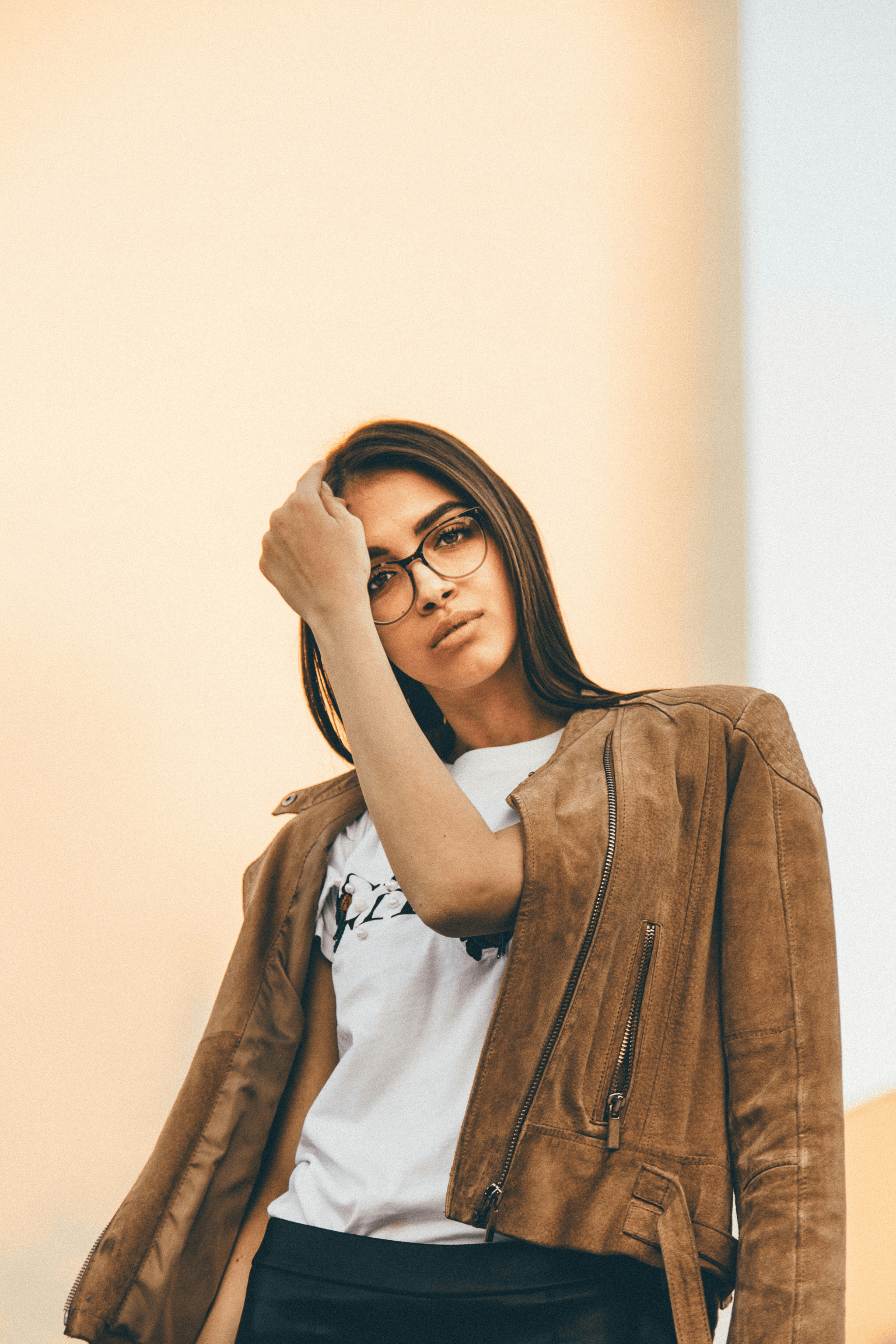 Stylish woman wearing trendy thick rimmed glasses.