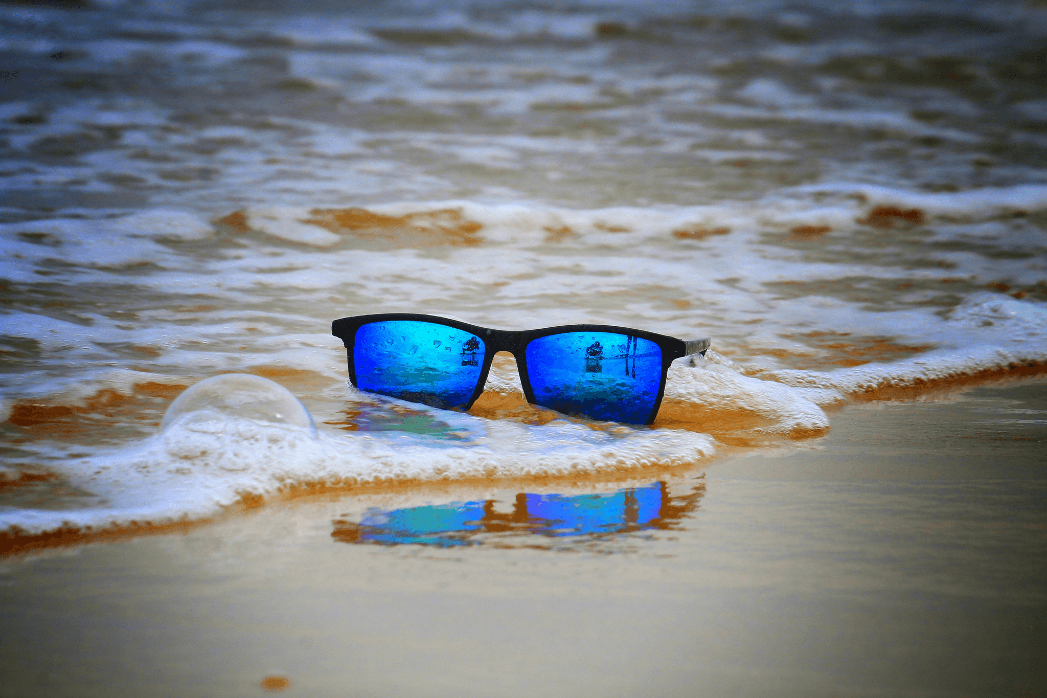 floating sunglasses polarized reflecting sunlight near water