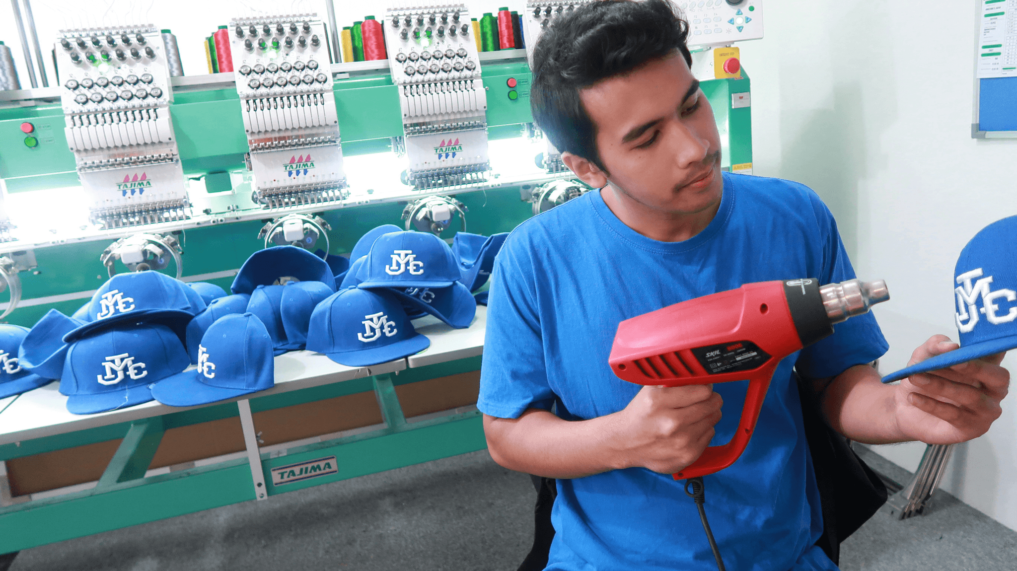 Hat manufacturers producing various styles of custom caps