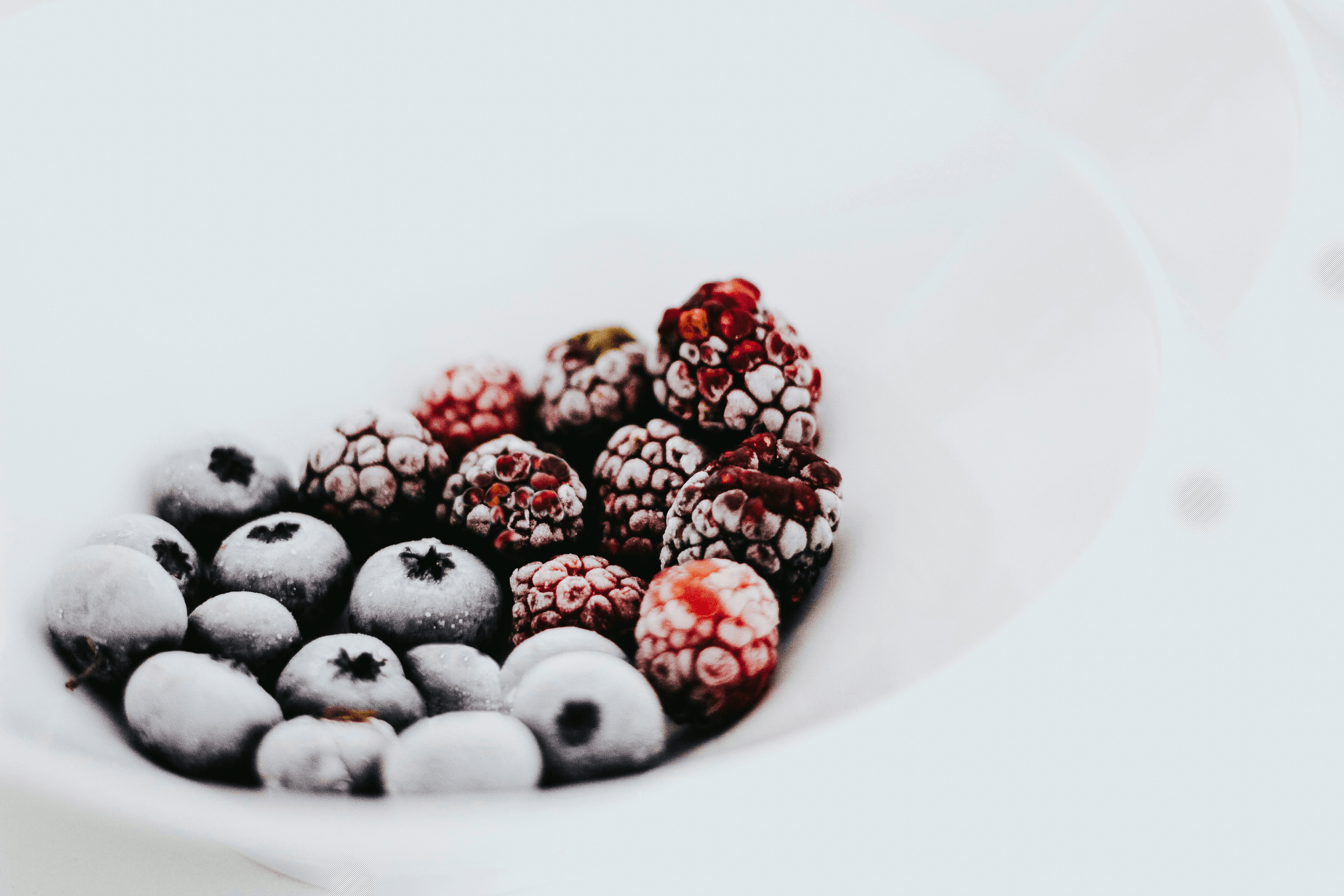 Delicious blackberry freeze dried among colorful fruits.