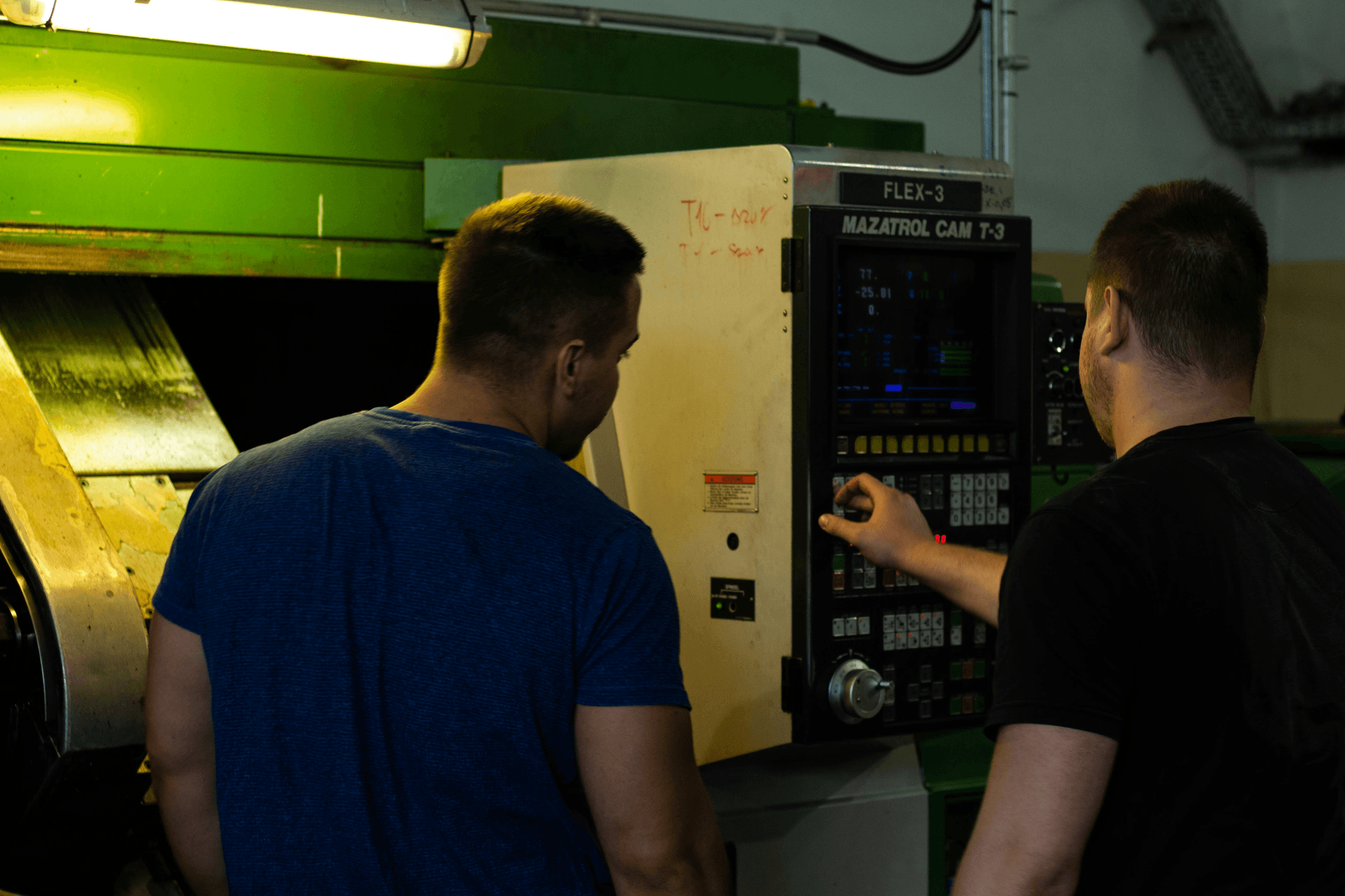 Group observing factory witness test for quality assurance.