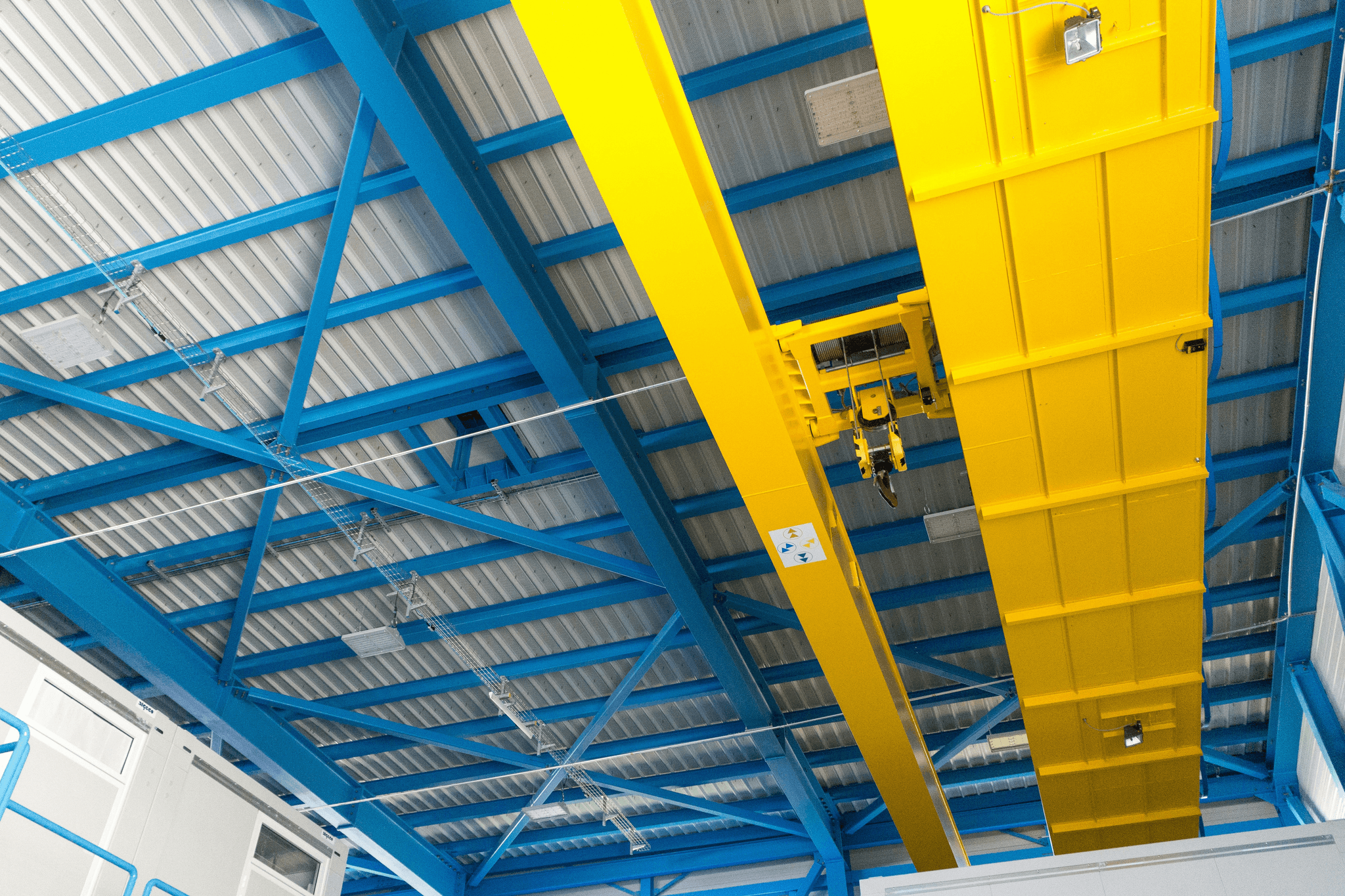 prefab steel structure being assembled at a construction site