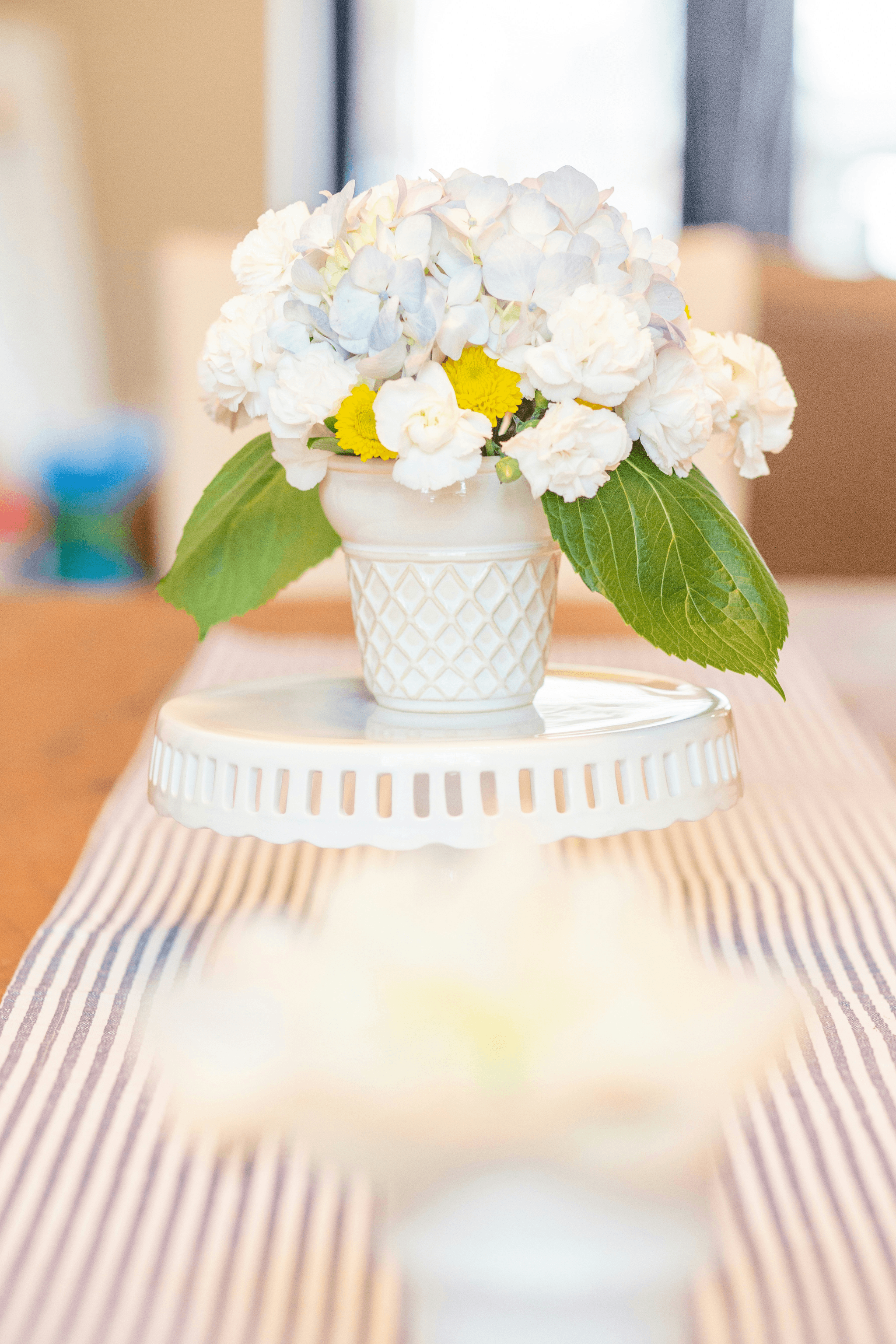 Elegant centerpiece featuring pink and green dried hydrangeas