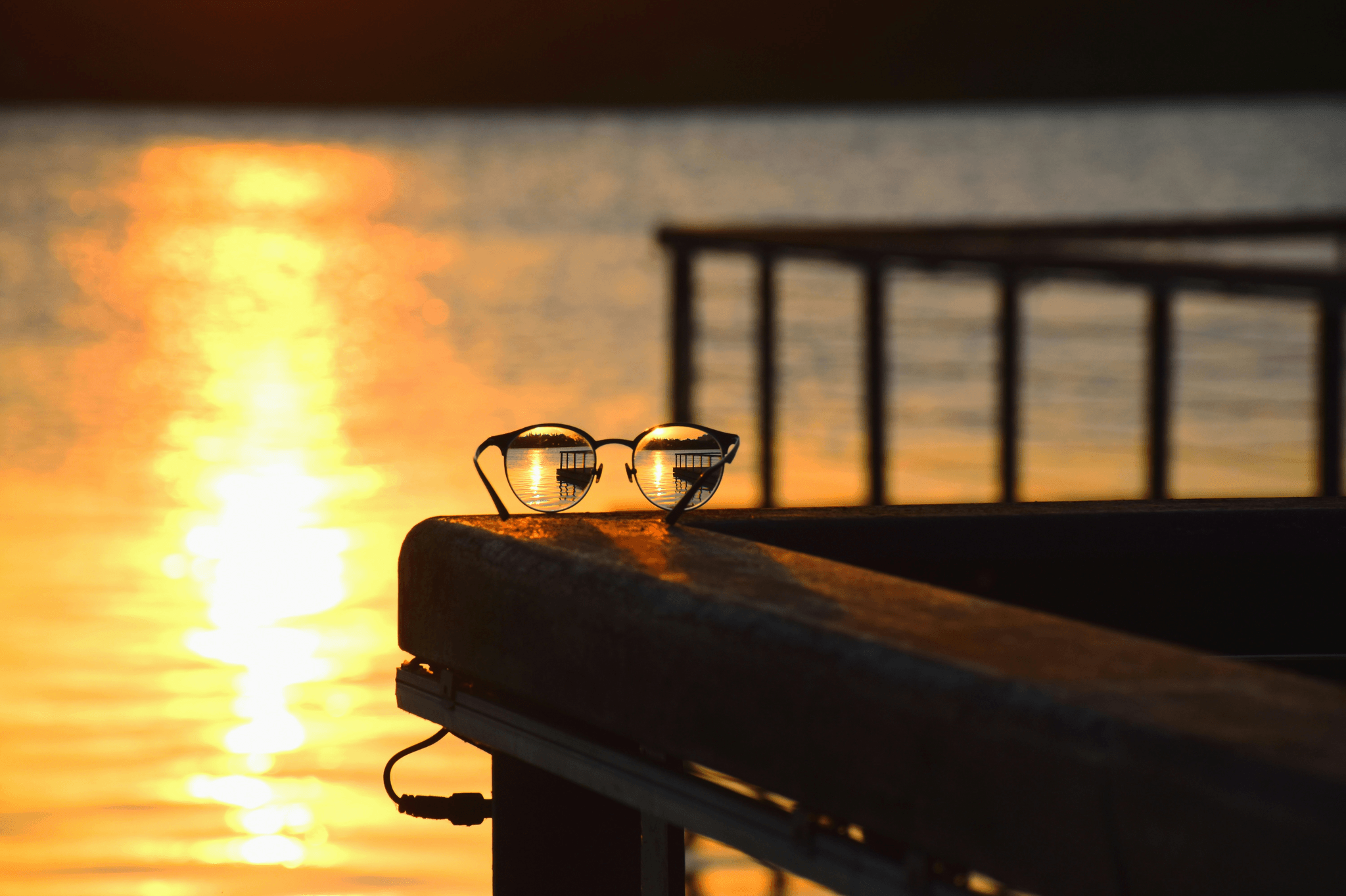 fishing sunglasses displayed near water