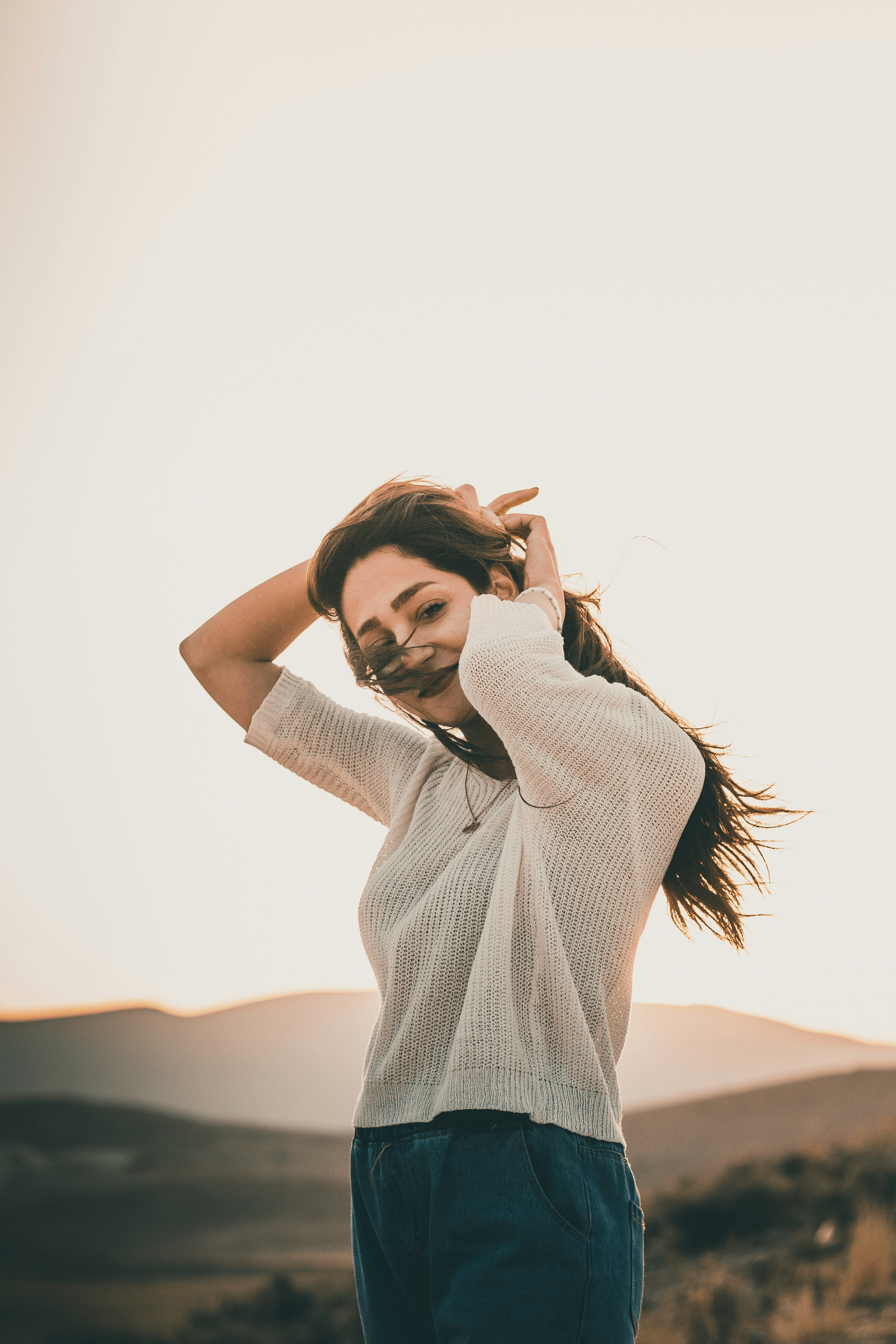 Straight Hair Extensions styled into effortless updo and glamorous waves for holiday photos