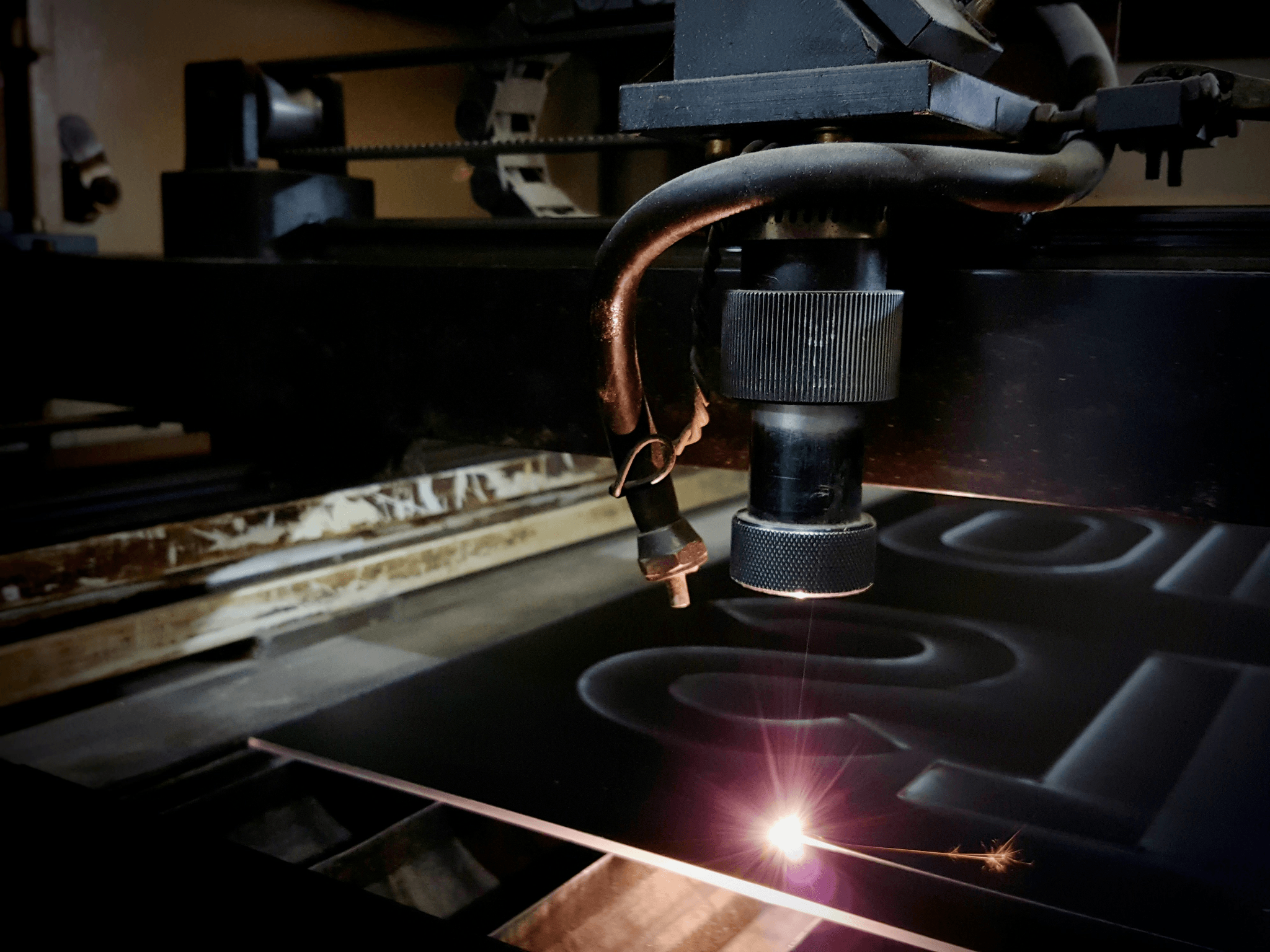 industrial cnc laser cutter working on metal tubes