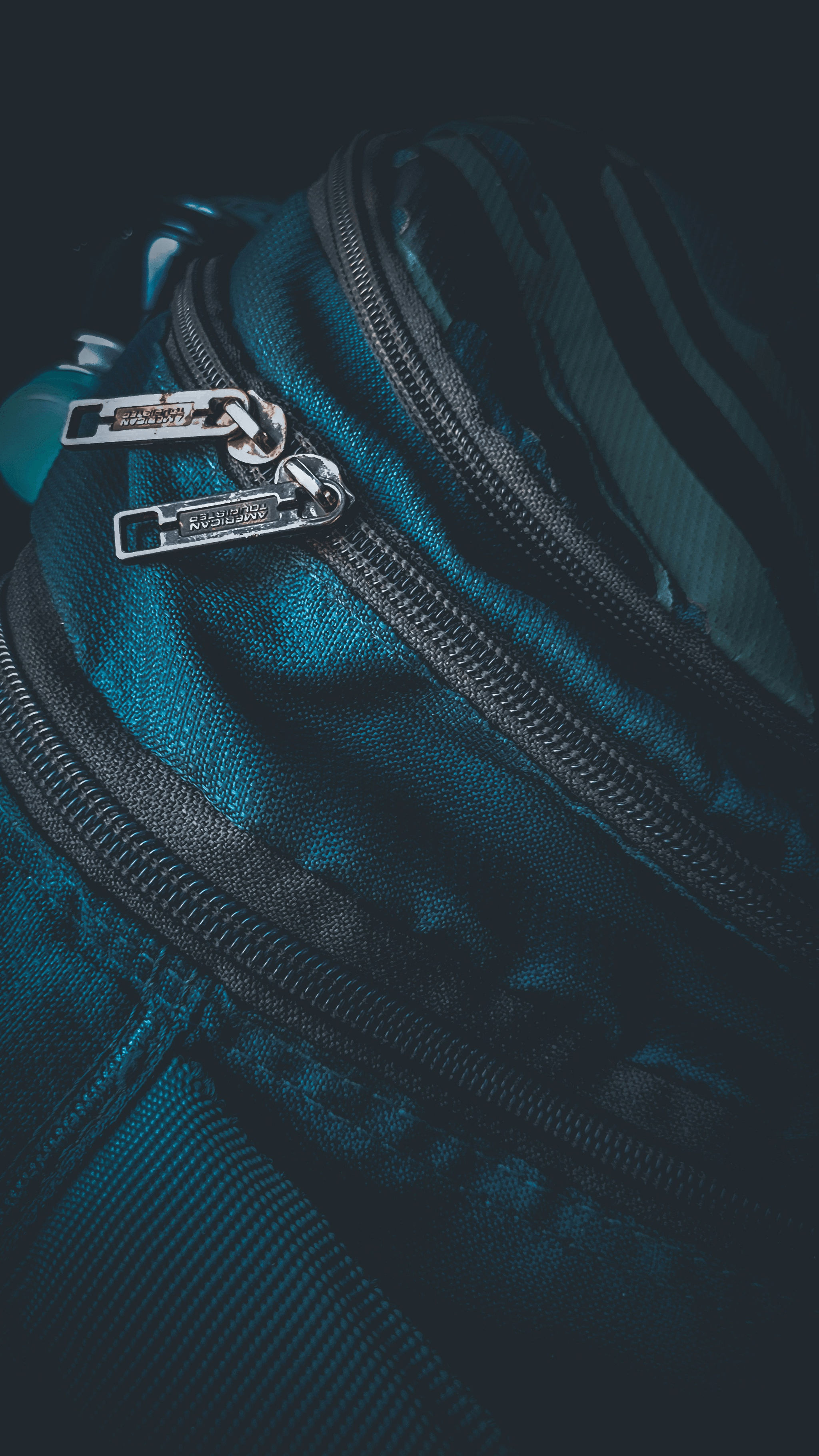 Luggage Inspection focusing on zipper quality in travel accessories.