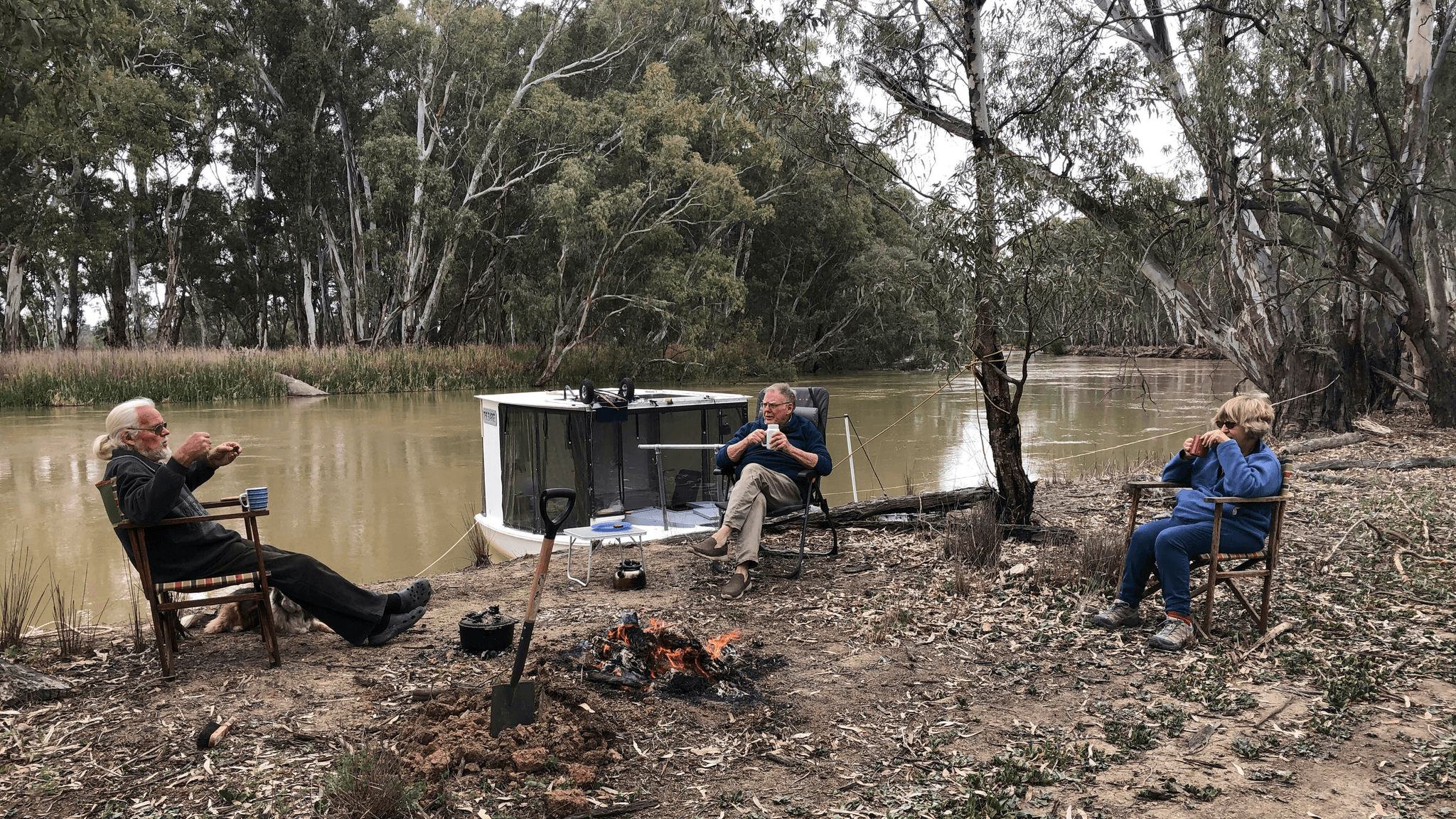 Relaxing evening by small aluminum fishing boat after successful day.