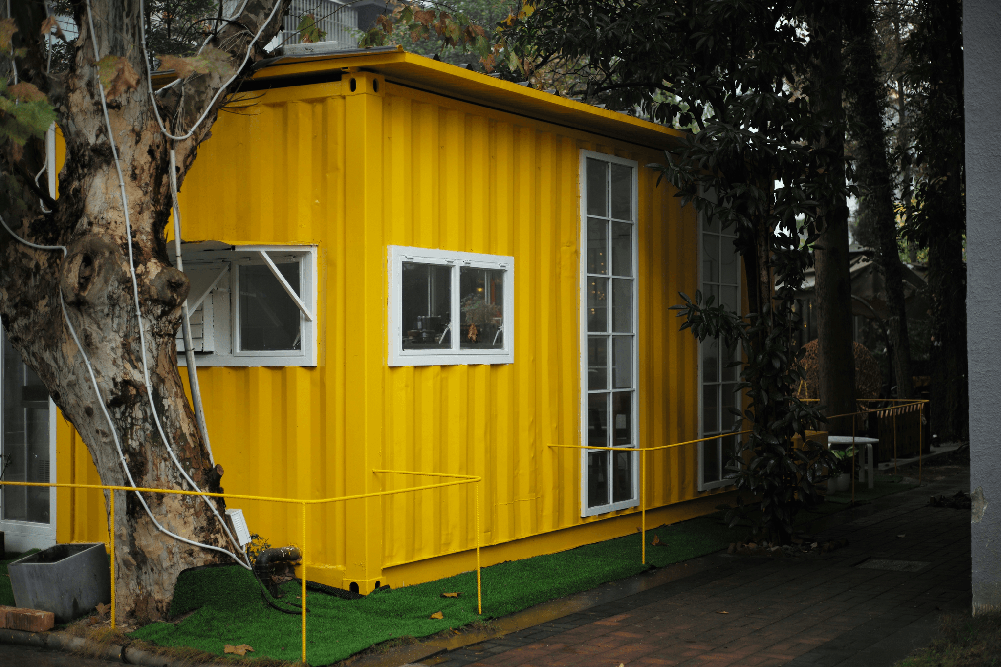 Versatile living spaces in an expandable container house
