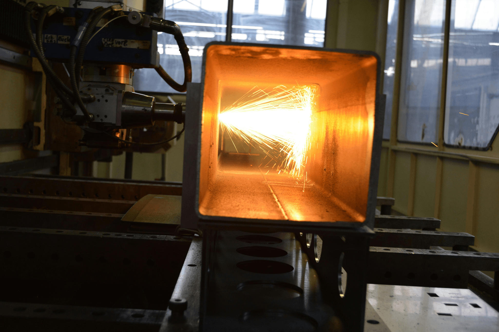 tube laser cutting machine performing precise cuts on steel tubes.