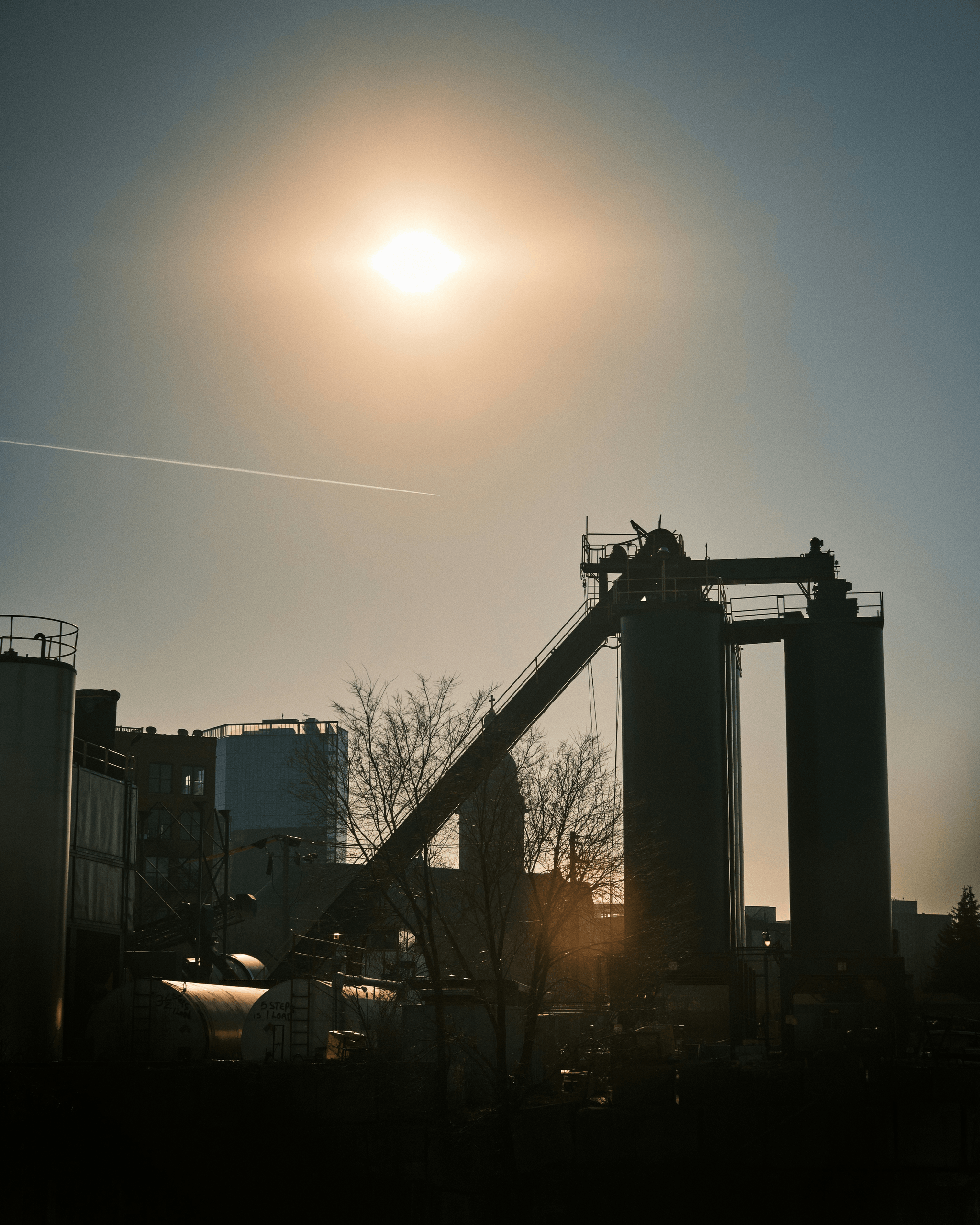 Eco-friendly Manufacturing Facility with Solar Panels and Wind Turbines